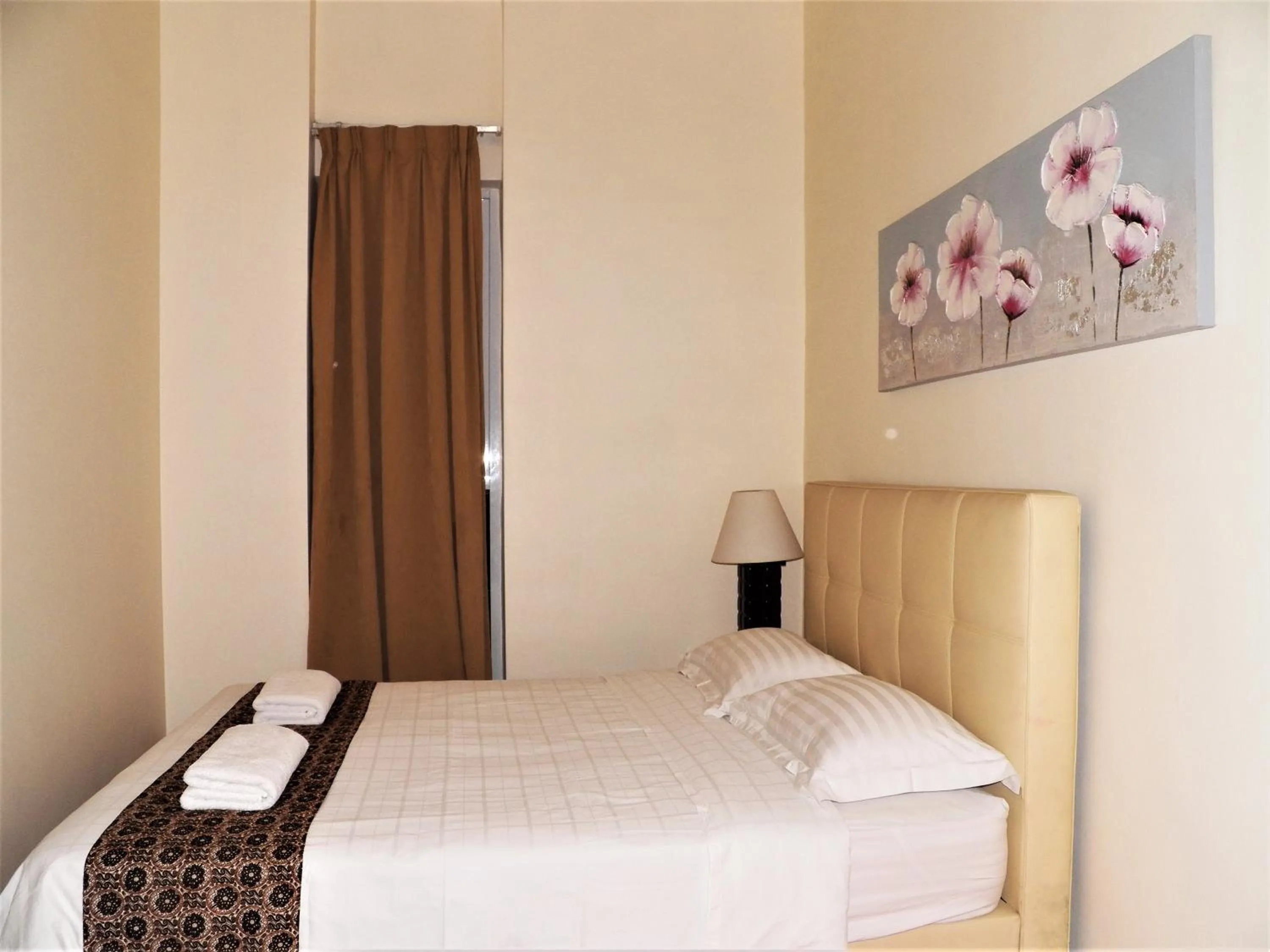 Bed in Maytower Apartment