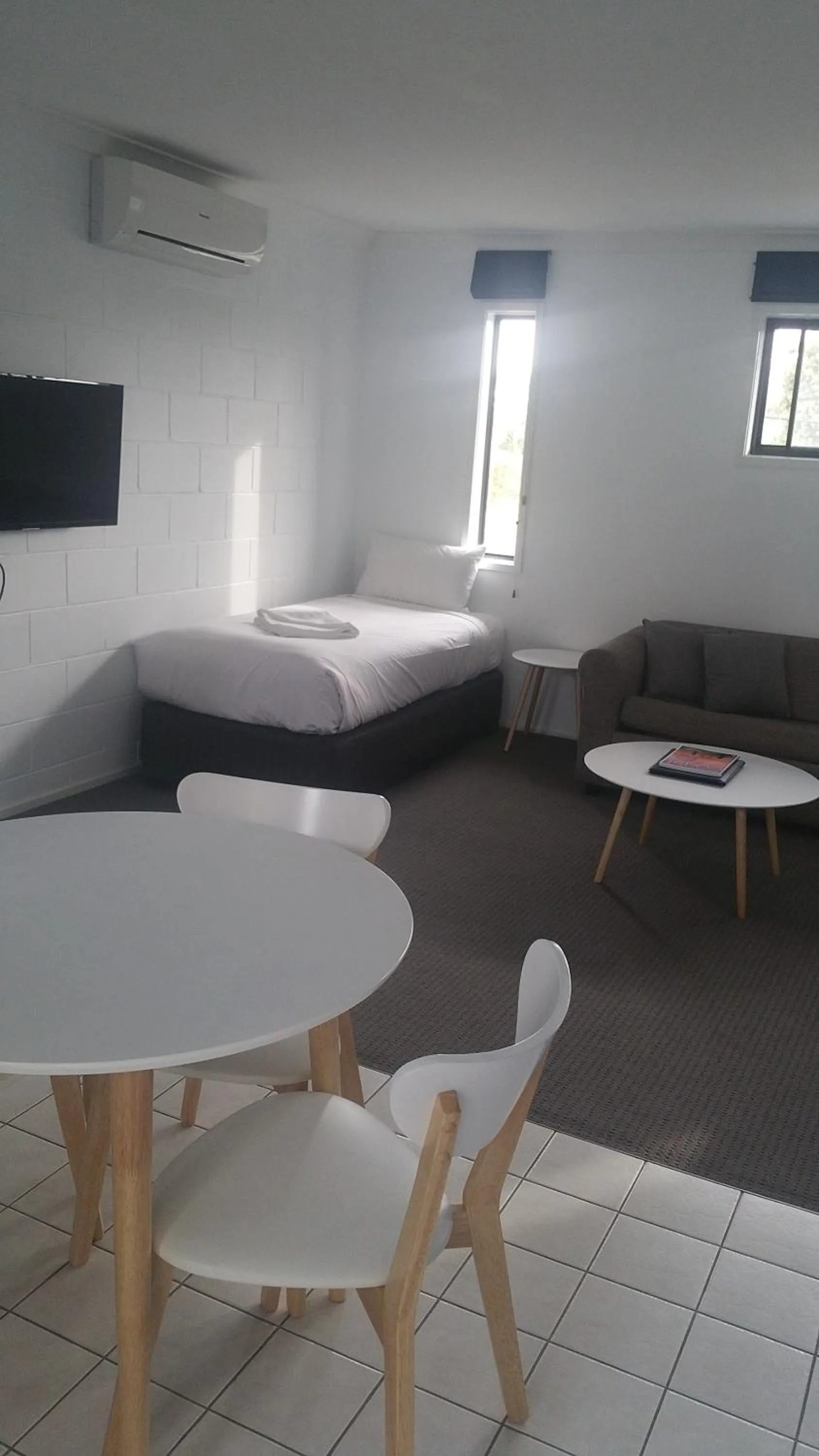 Seating area, Bed in Apartments At Glen Isla