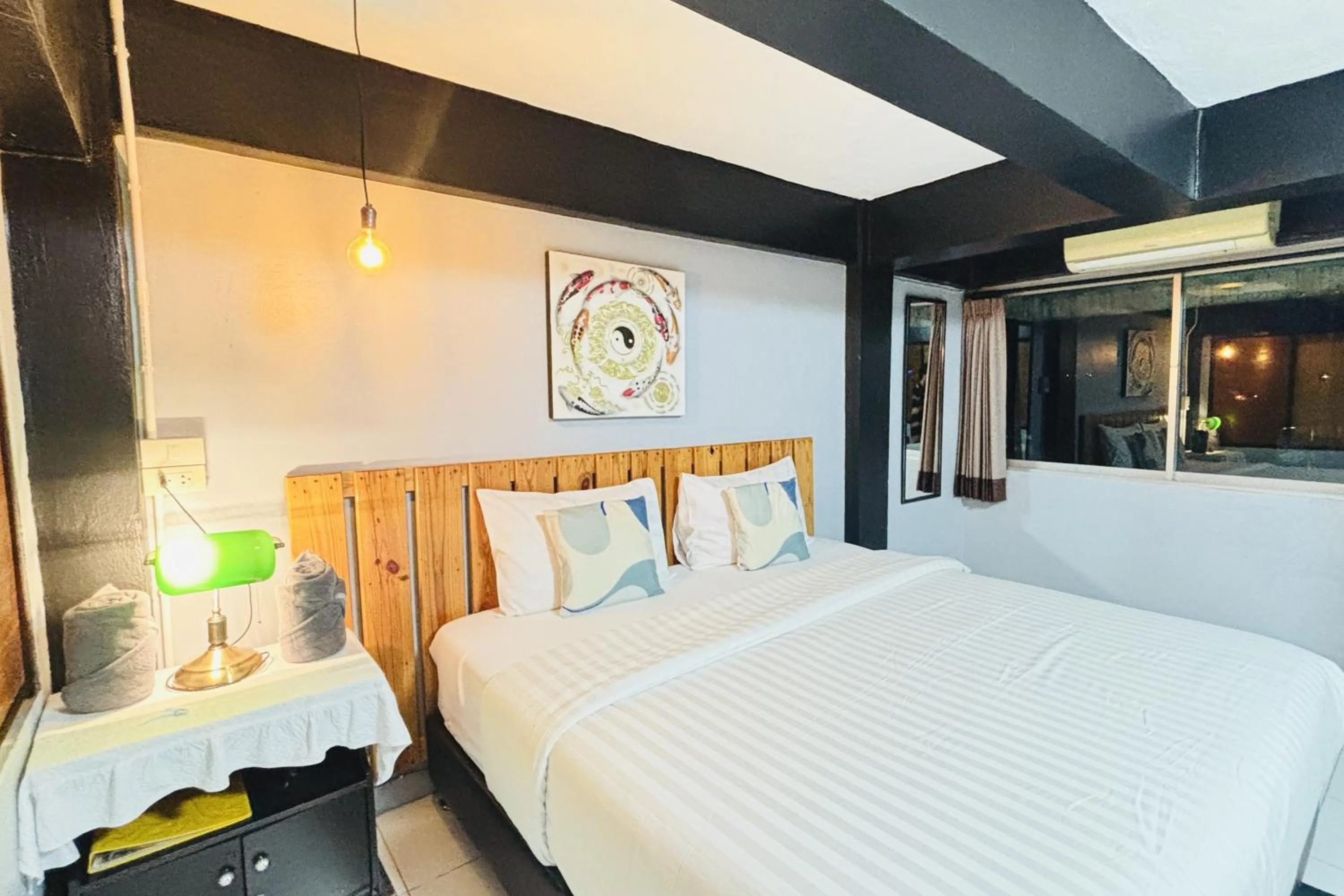 Bed in The Yak Cozy Chiang Mai