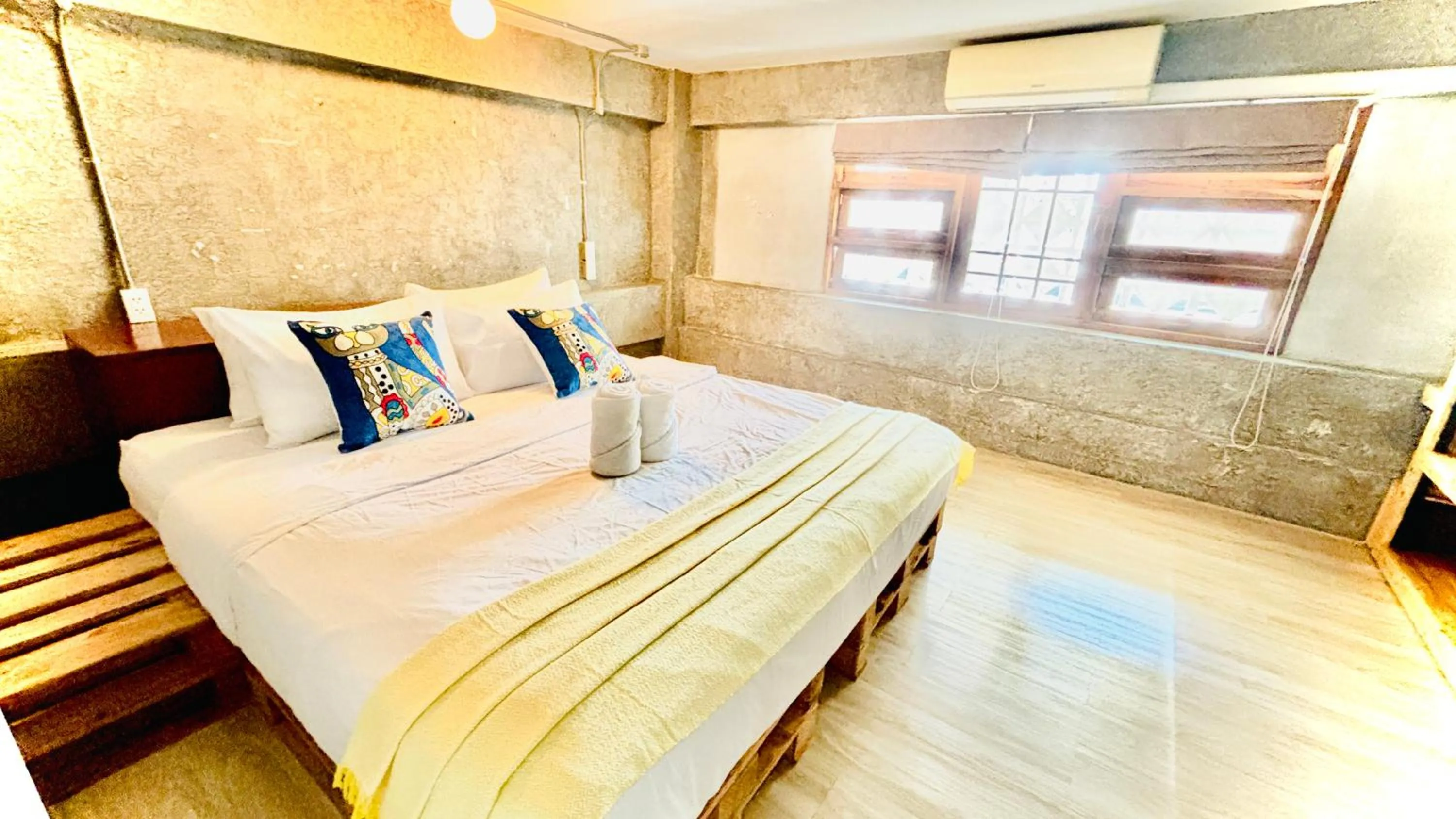 Bed in The Yak Cozy Chiang Mai