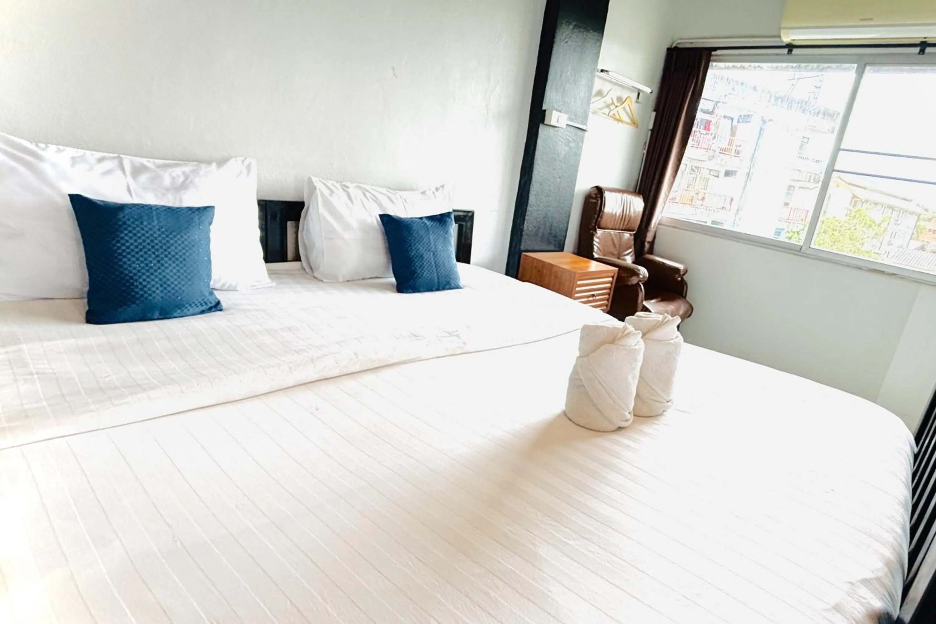 Bed in The Yak Cozy Chiang Mai