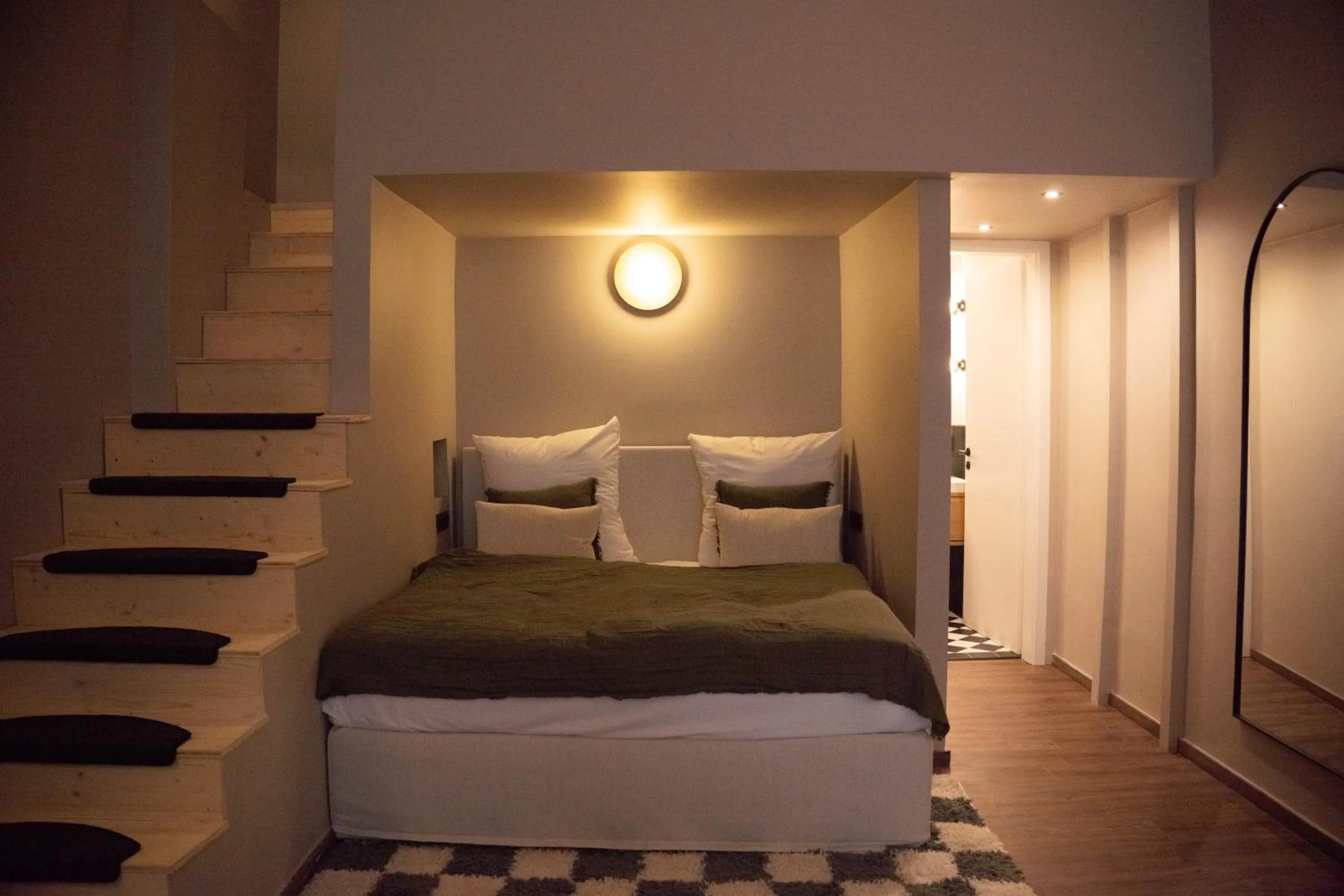 Bed in The Charming by Curt Suites