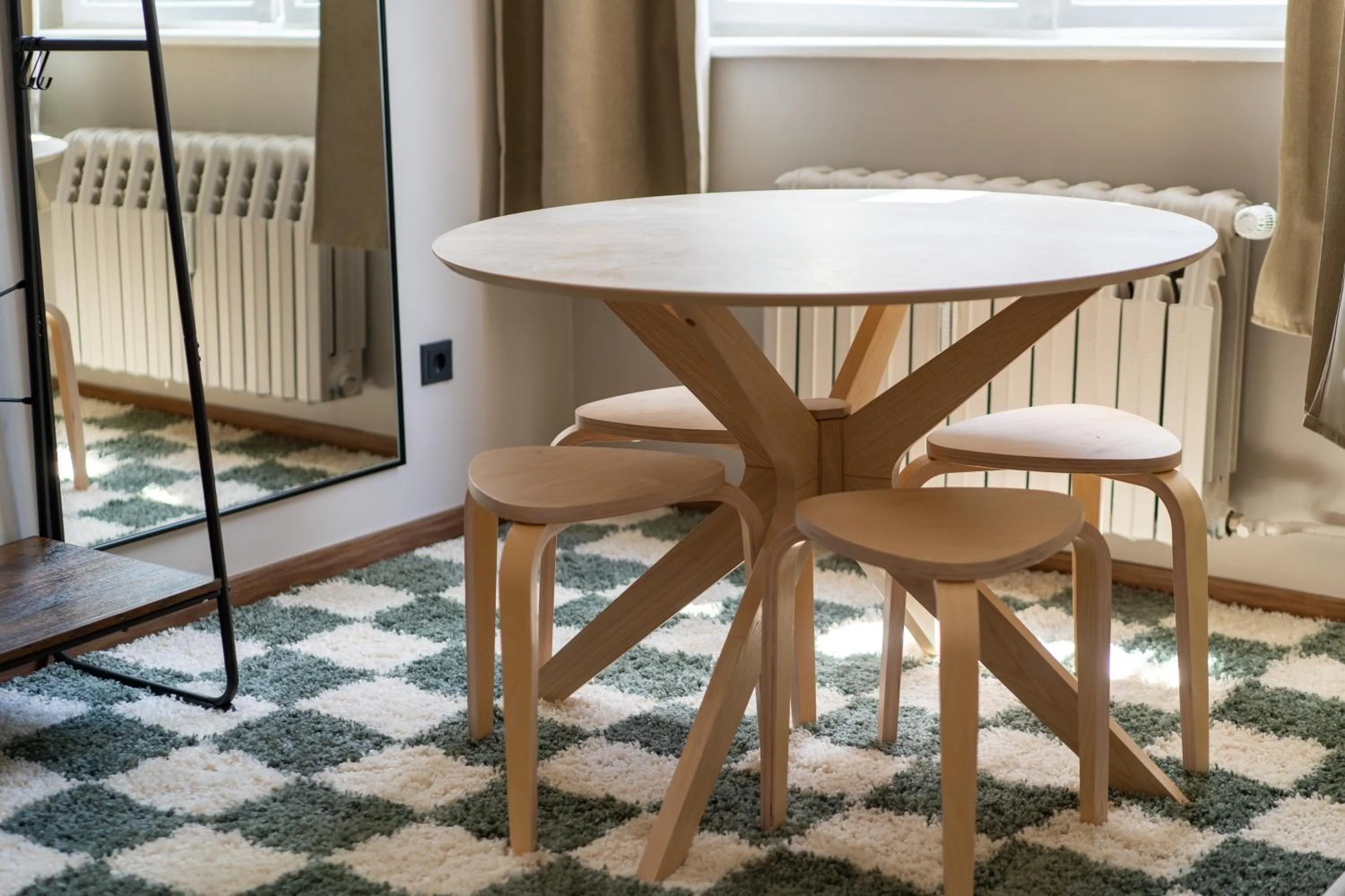 Living room in The Charming by Curt Suites