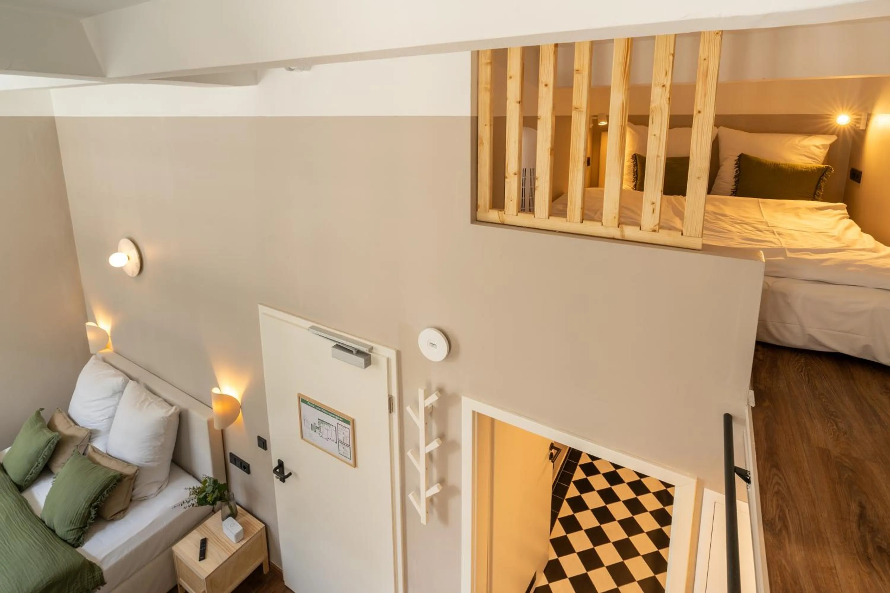 Bed in The Charming by Curt Suites