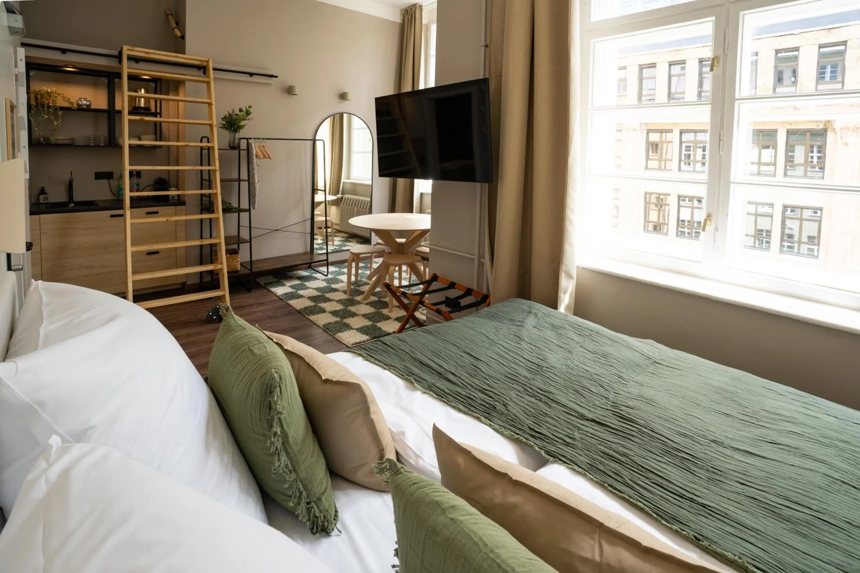 Bed in The Charming by Curt Suites