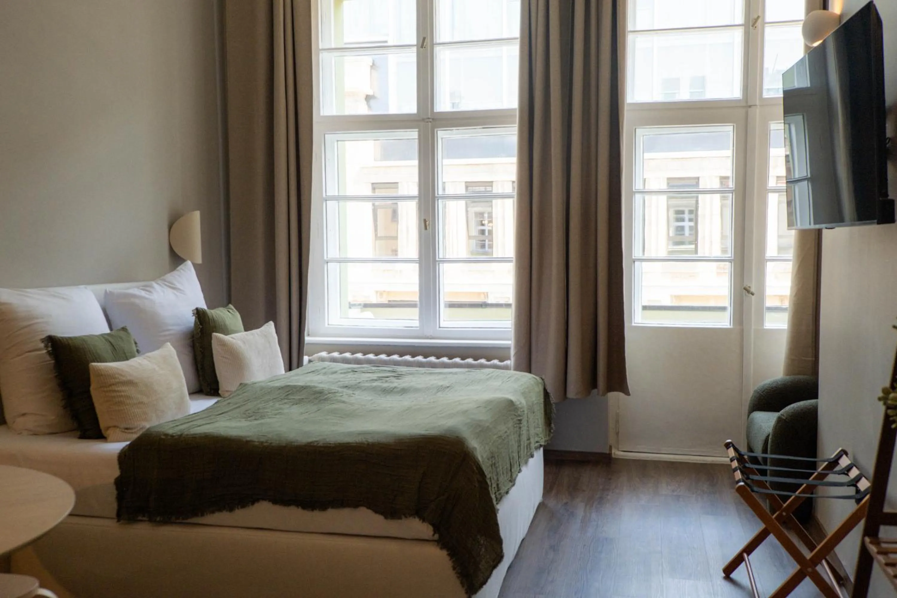 Bed in The Charming by Curt Suites