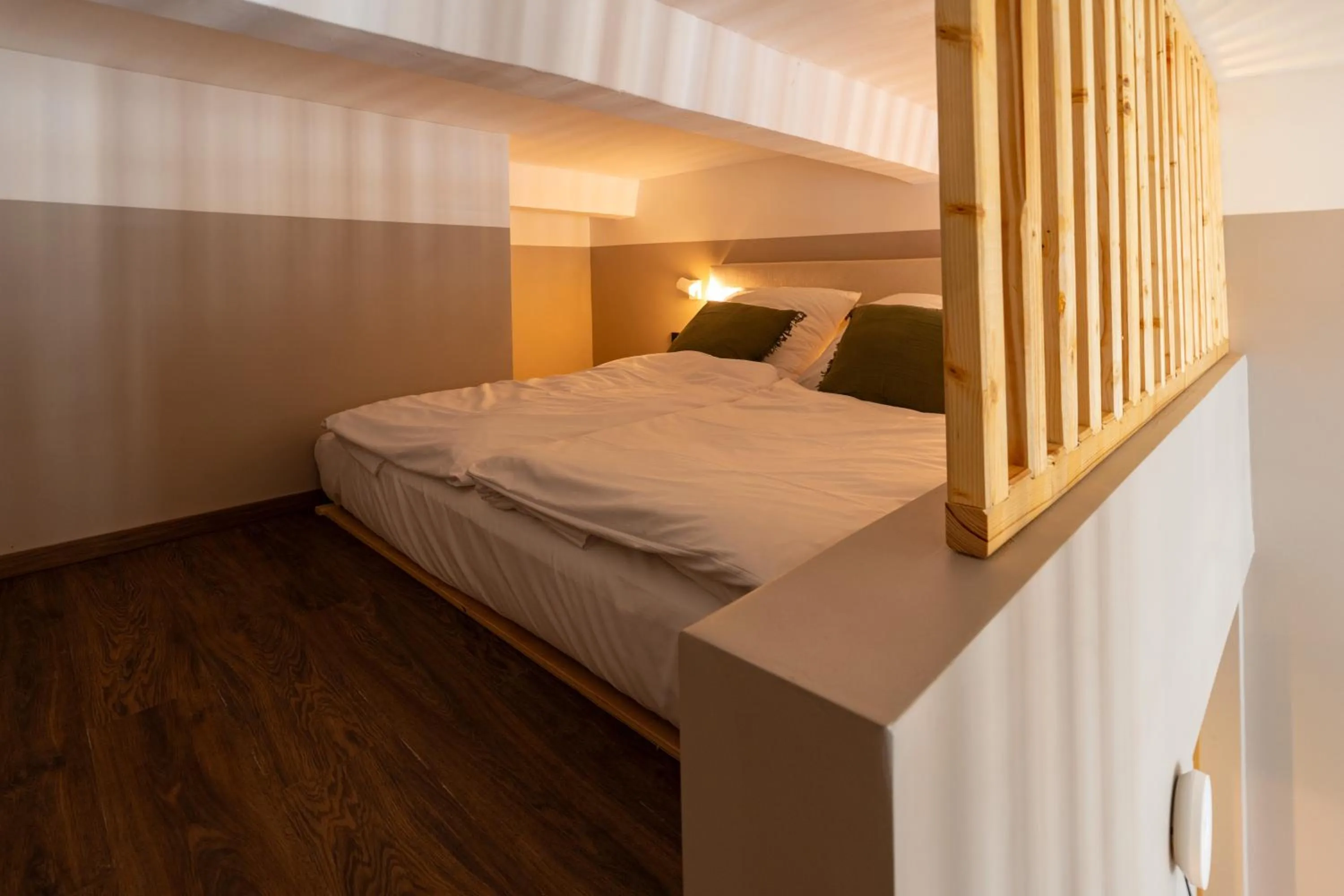 Bed in The Charming by Curt Suites