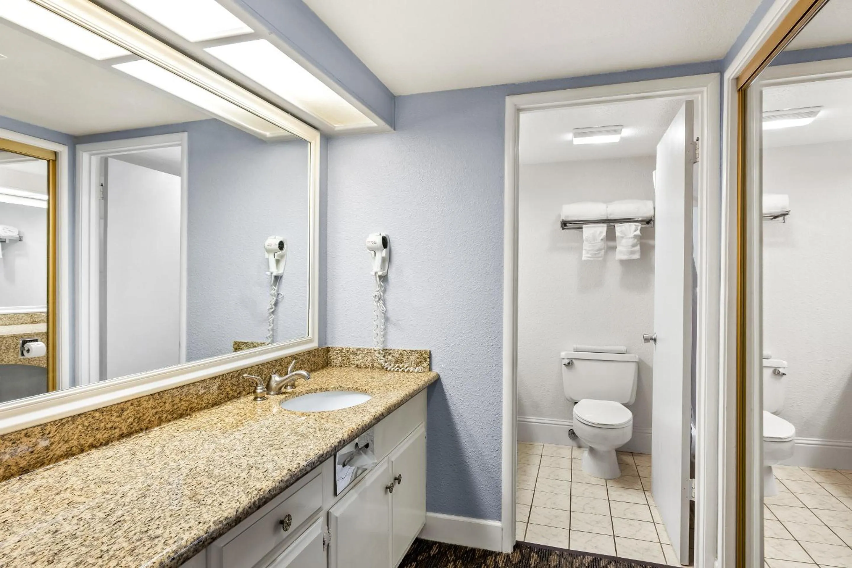 Bathroom in HomeTowne Studios by Red Roof Yuba City Bonanza - Marysville