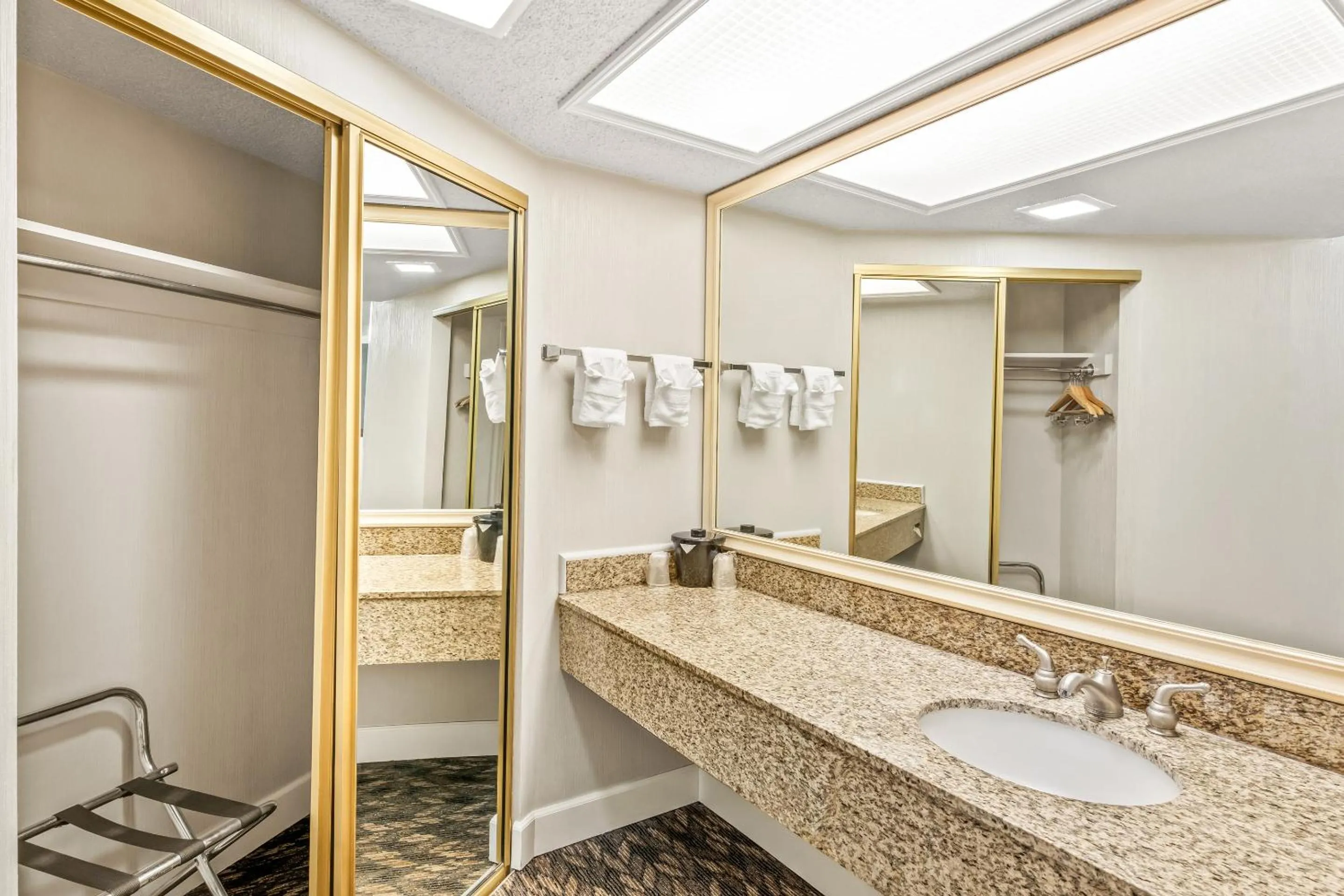 Bathroom in HomeTowne Studios by Red Roof Yuba City Bonanza - Marysville