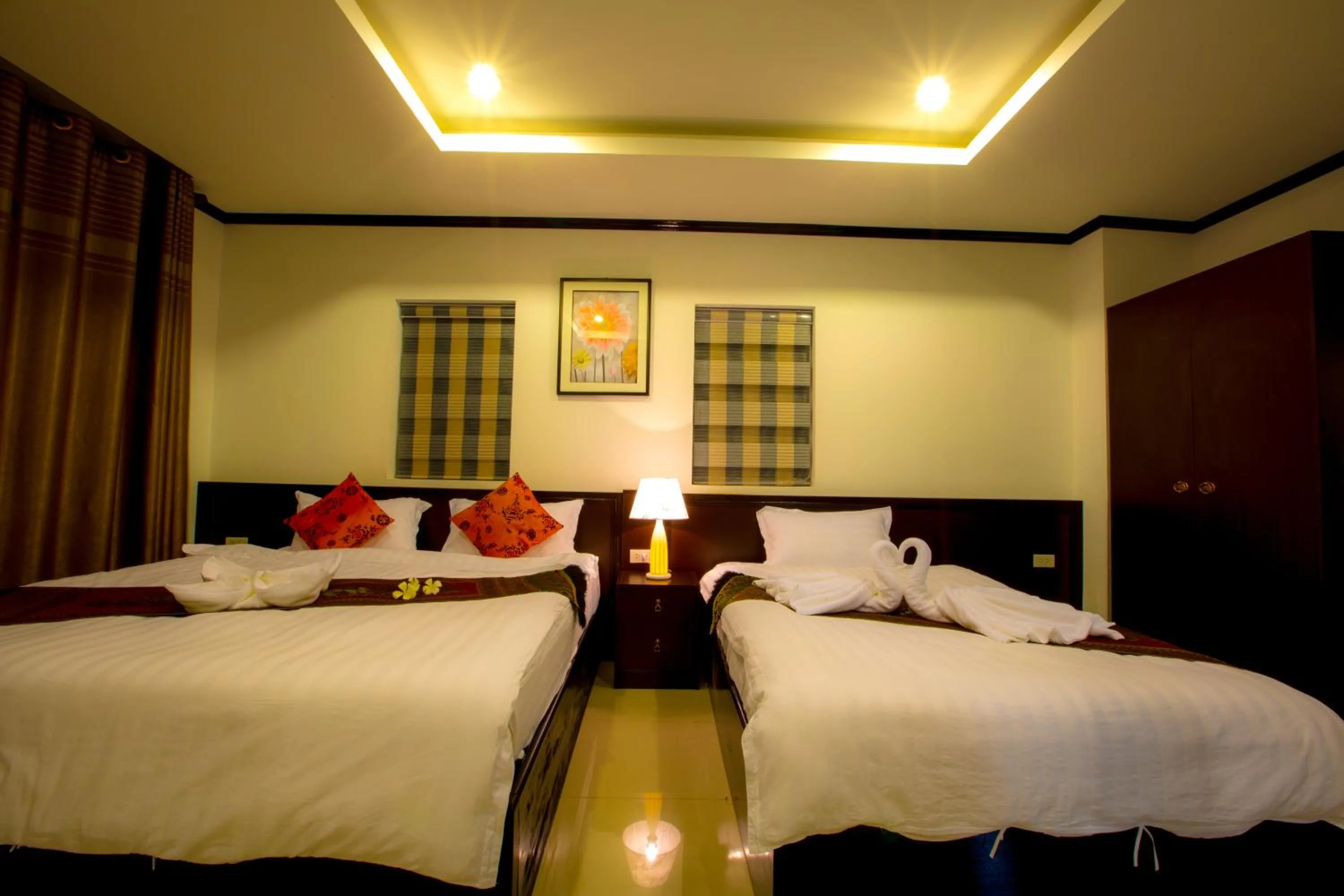 Bed in Douangchan Plaza Hotel