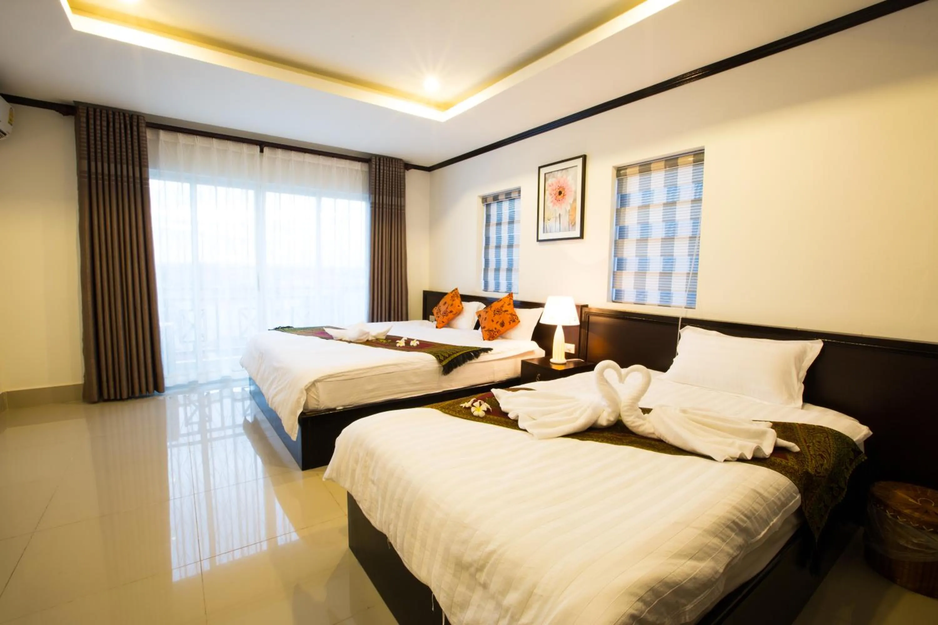 Bed in Douangchan Plaza Hotel