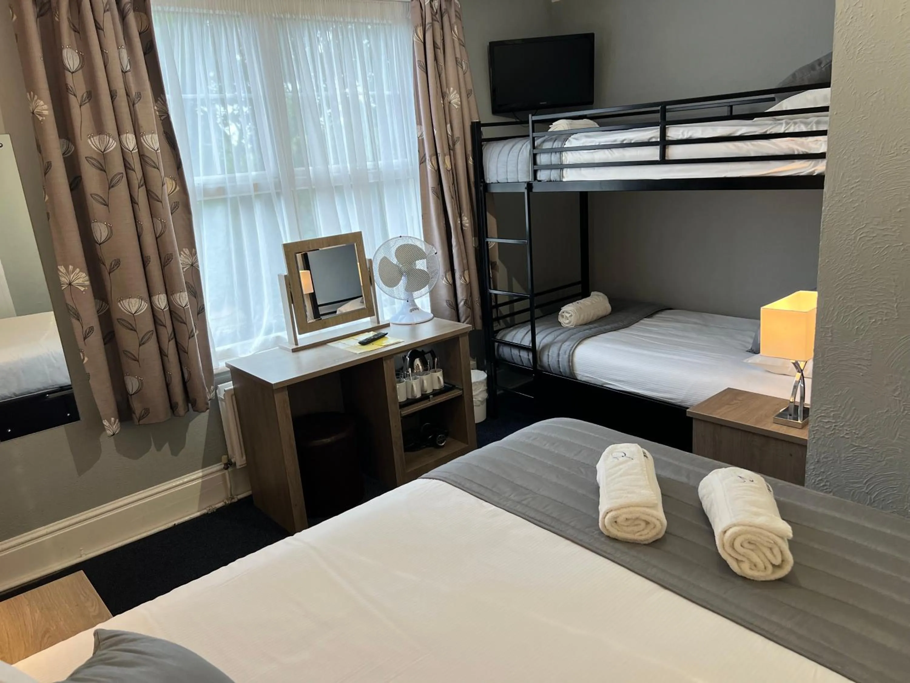 Bed in Corner House Hotel Gatwick with bookable Holiday parking