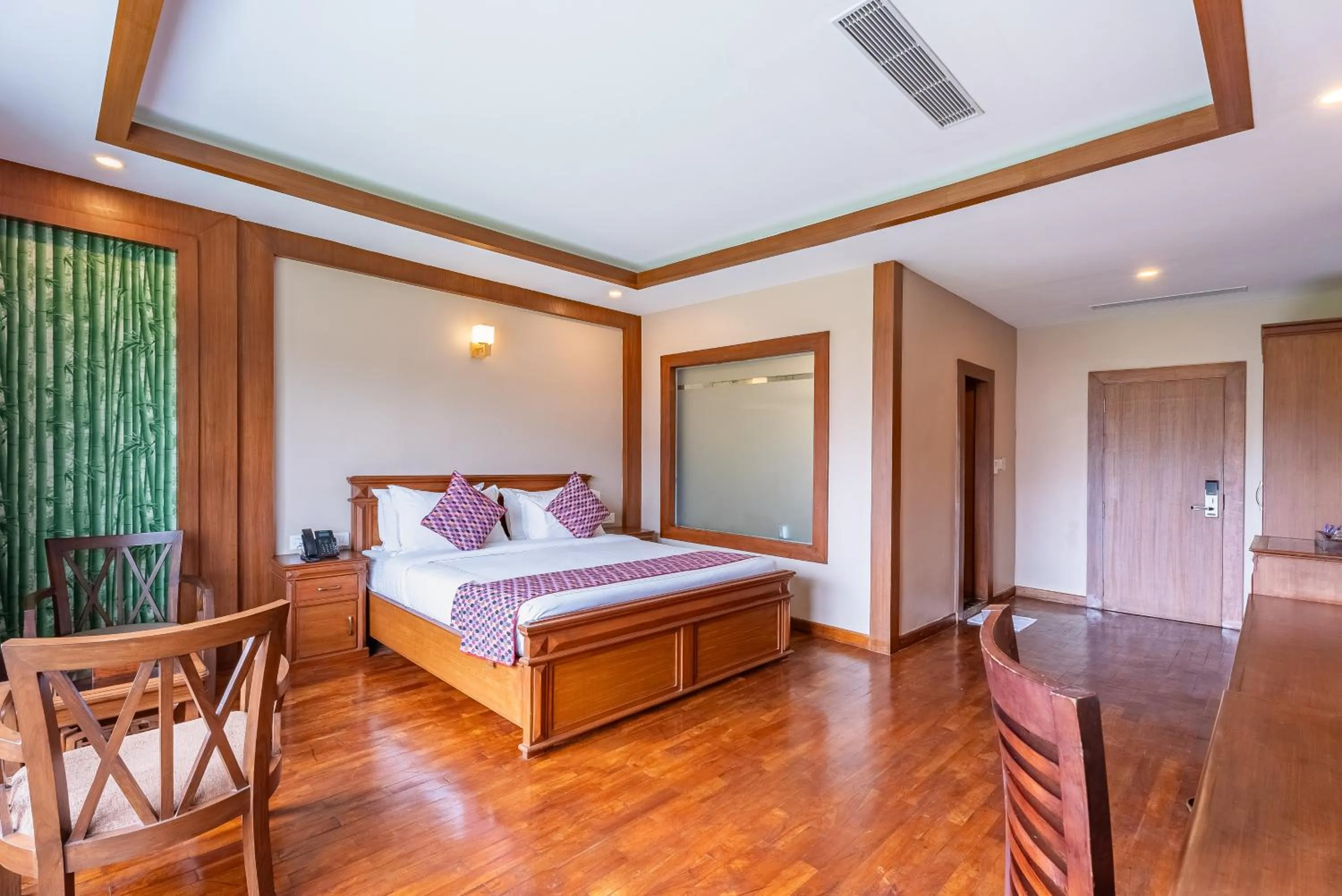 Bed in River Bank Jungle Resort, Chitwan