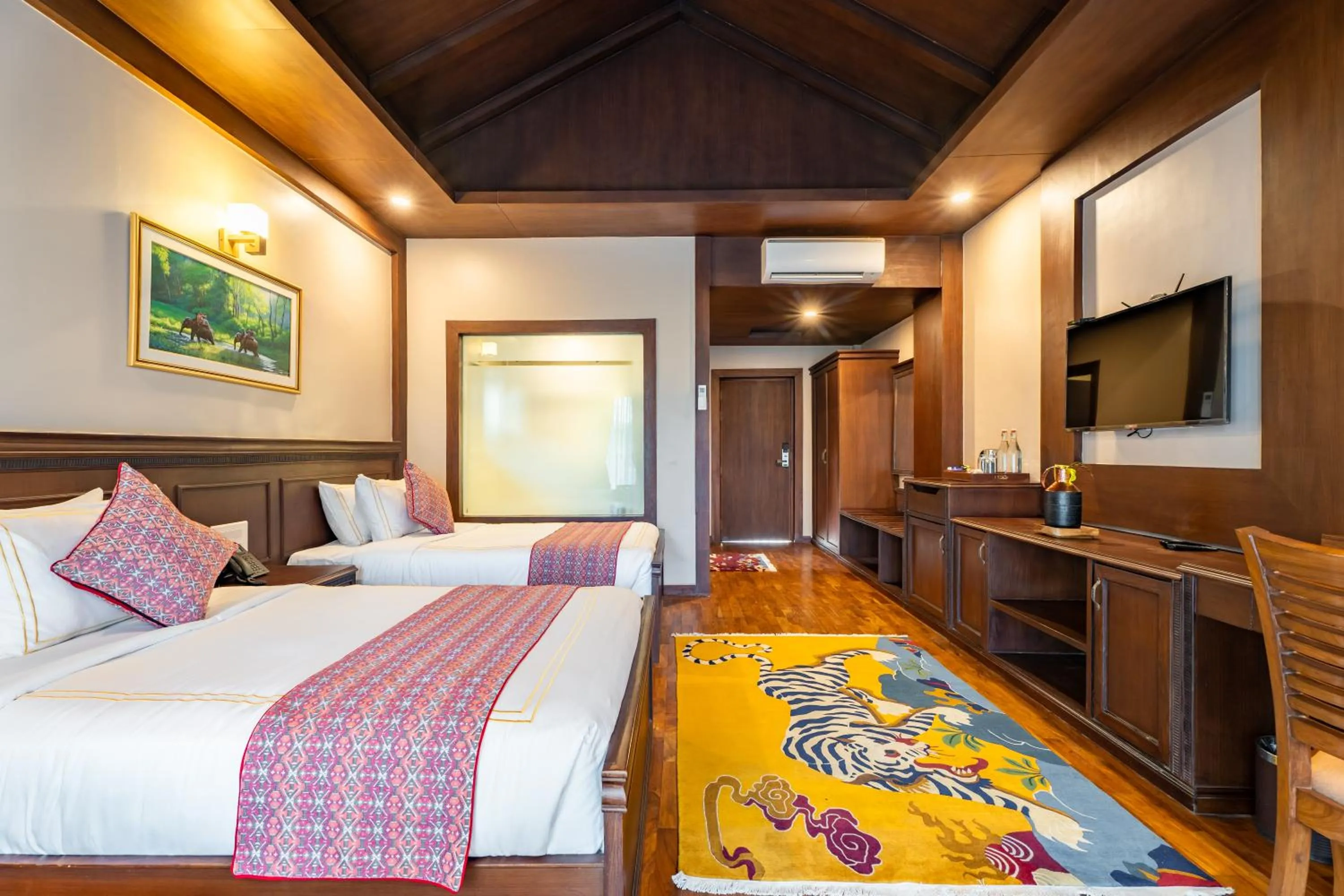 Bed in River Bank Jungle Resort, Chitwan