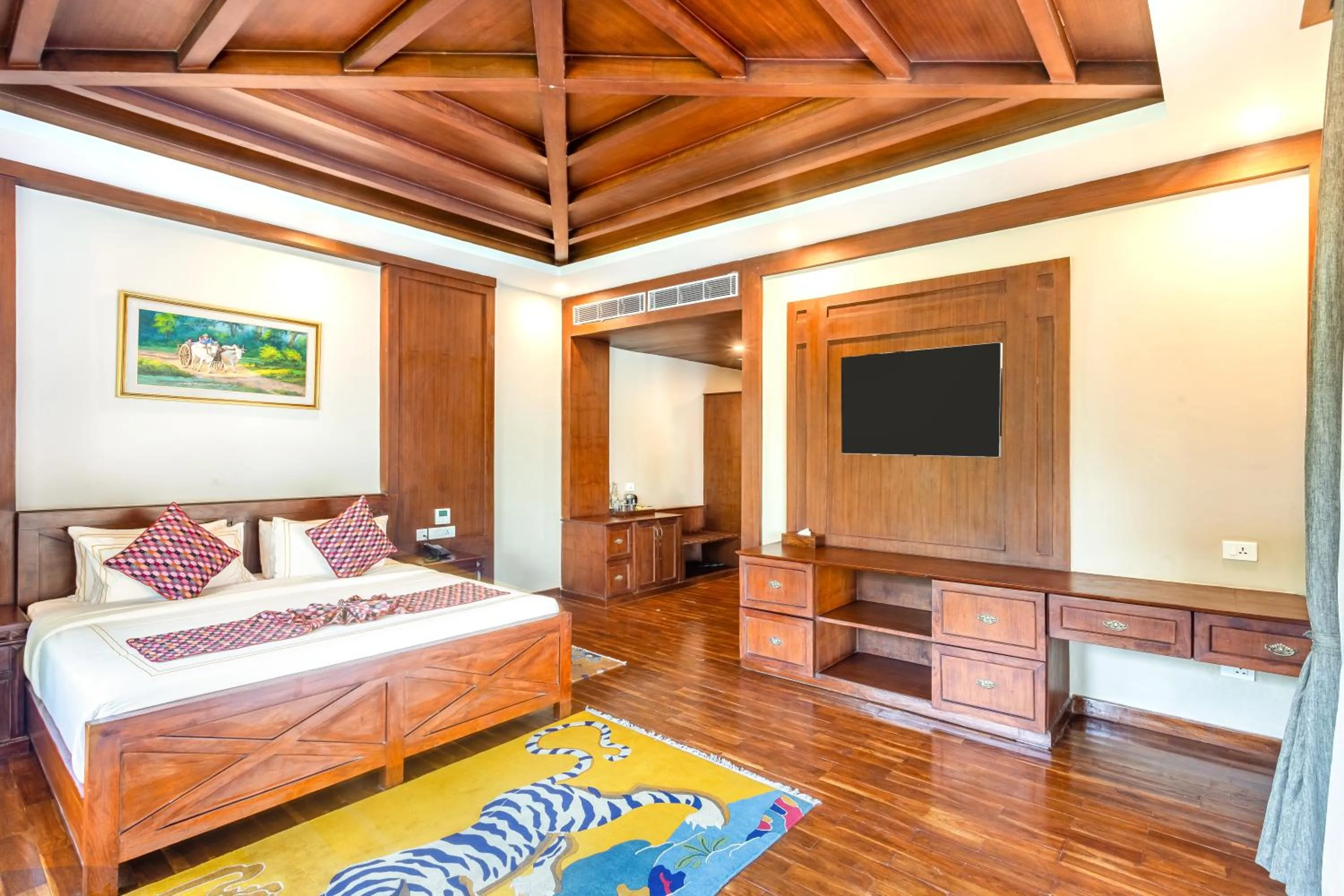 Bed in River Bank Jungle Resort, Chitwan