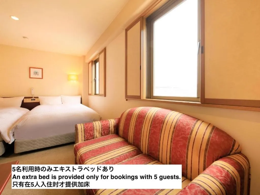 Bed in Centurion Hotel Hamamatsu