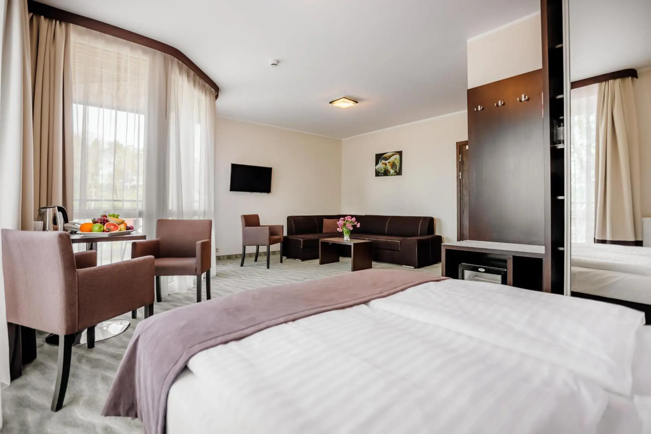 Family Room with Balcony and Partial Lake View in Hotel Emocja SPA Family Room with Balcony and Partial Lake View in Hotel Emocja SPA