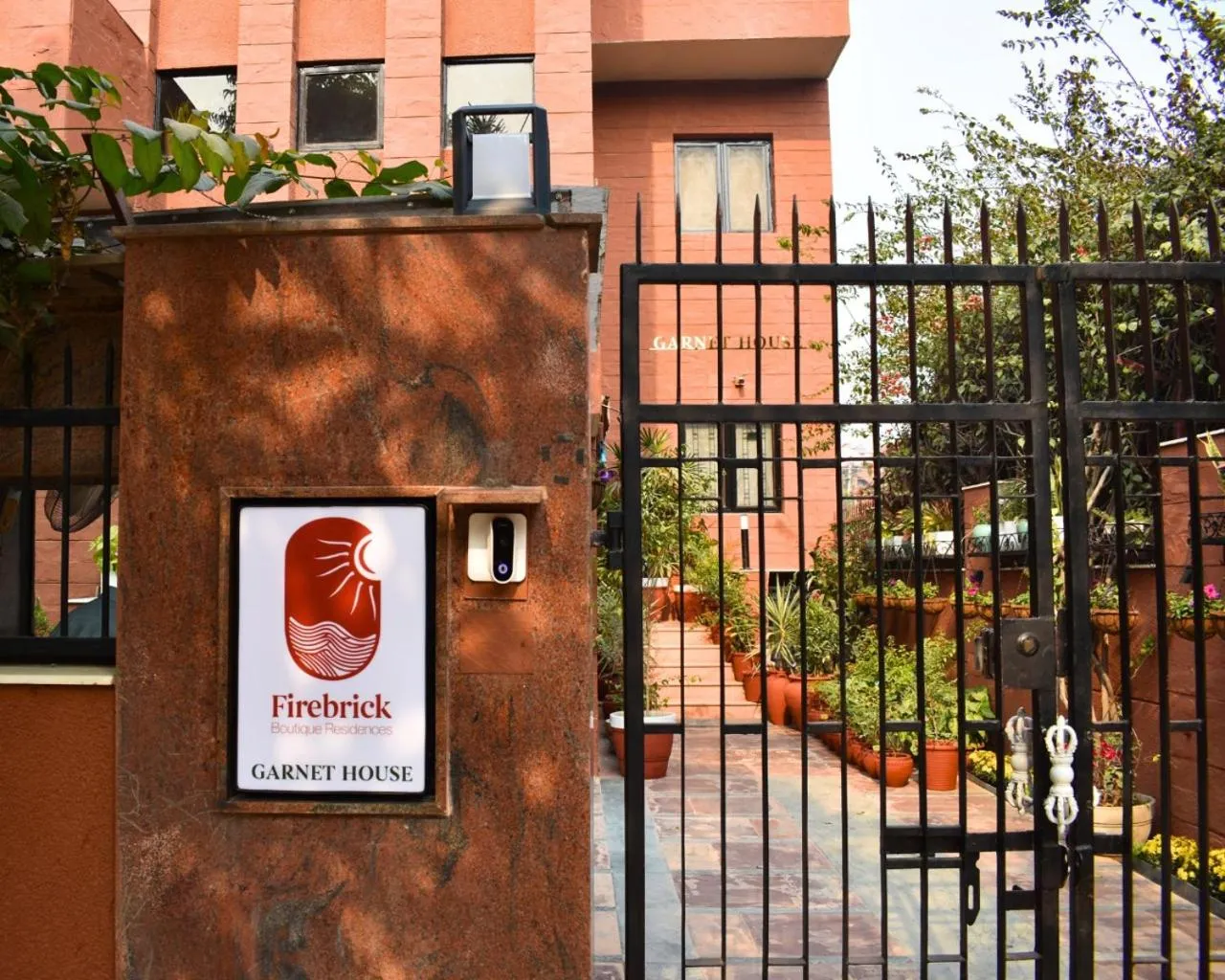 Property logo or sign in Firebrick Boutique Residences - GARNET HOUSE