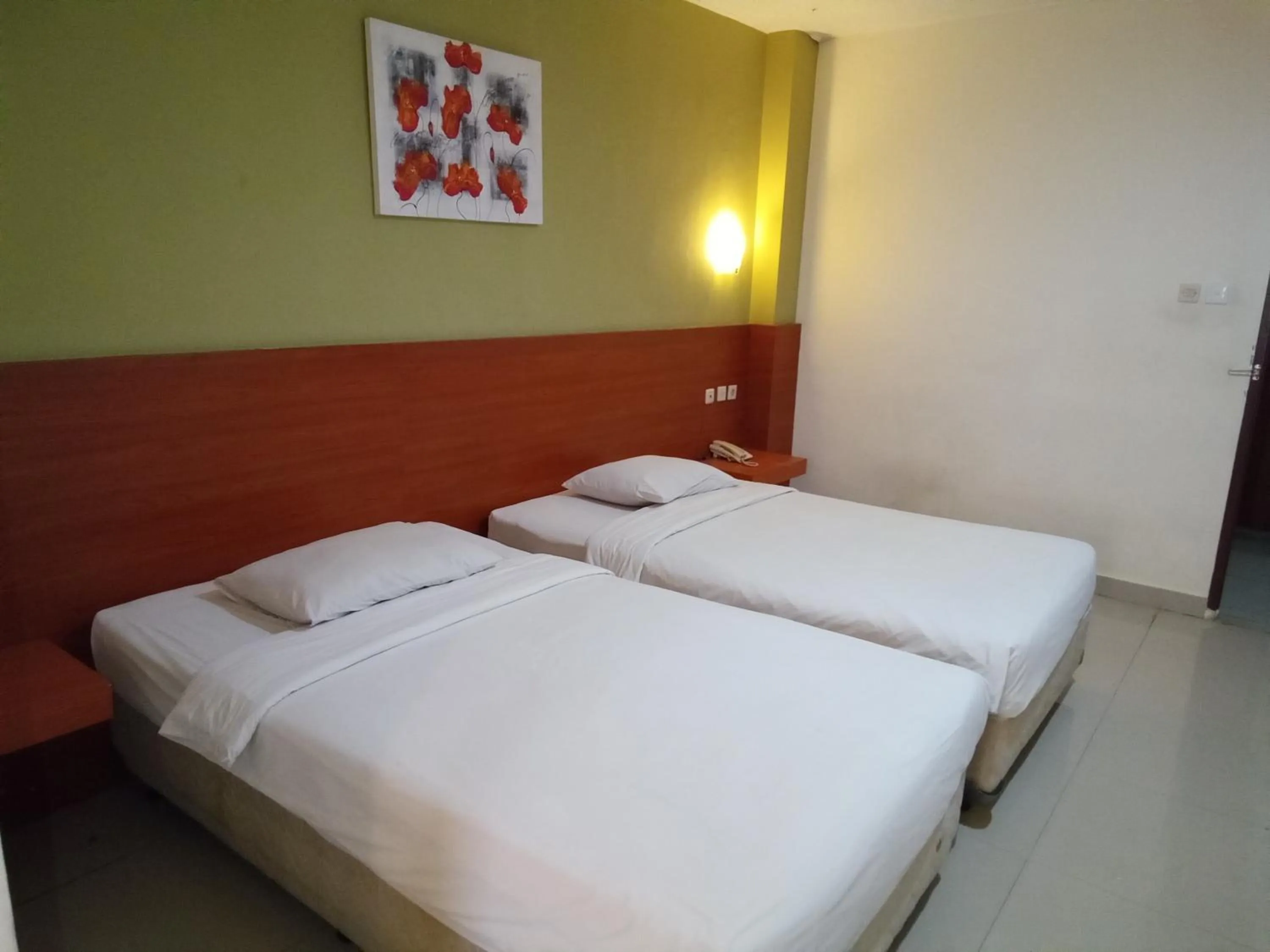 Bed in Puri Dibia Kuta Hotel & Apartment