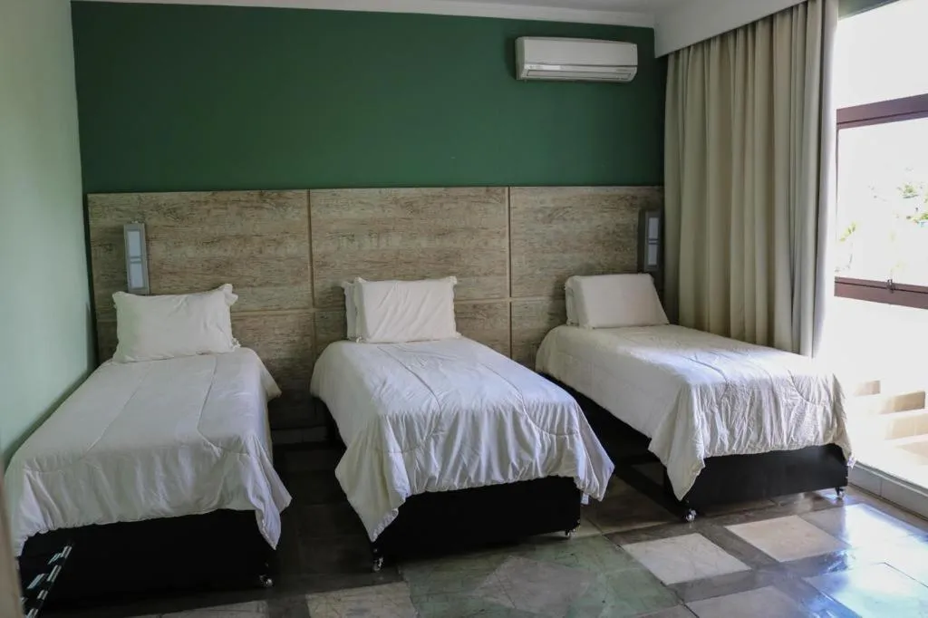 Bed in ARAGUAIA HOTEL