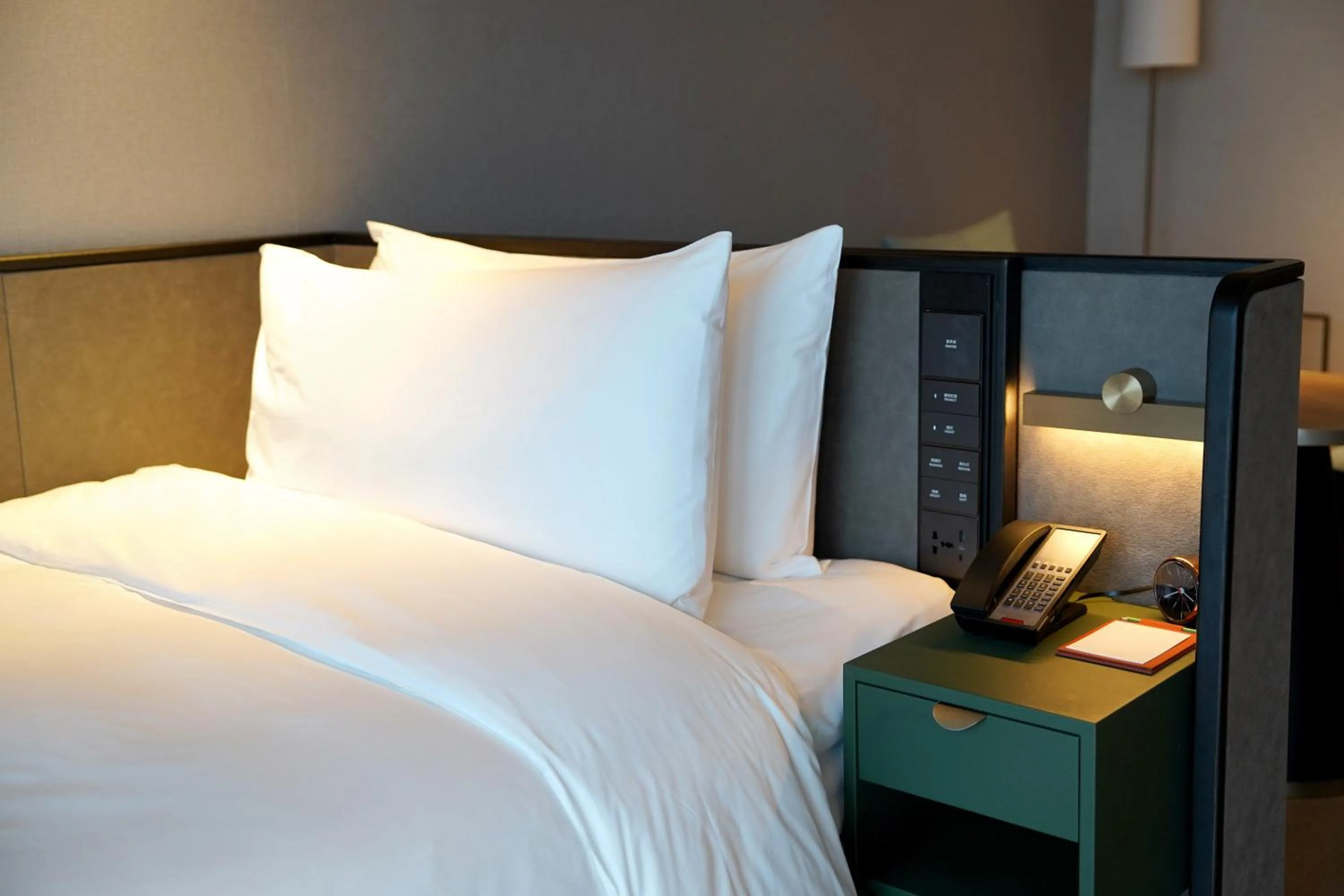 Bed in New World Guangzhou Hotel