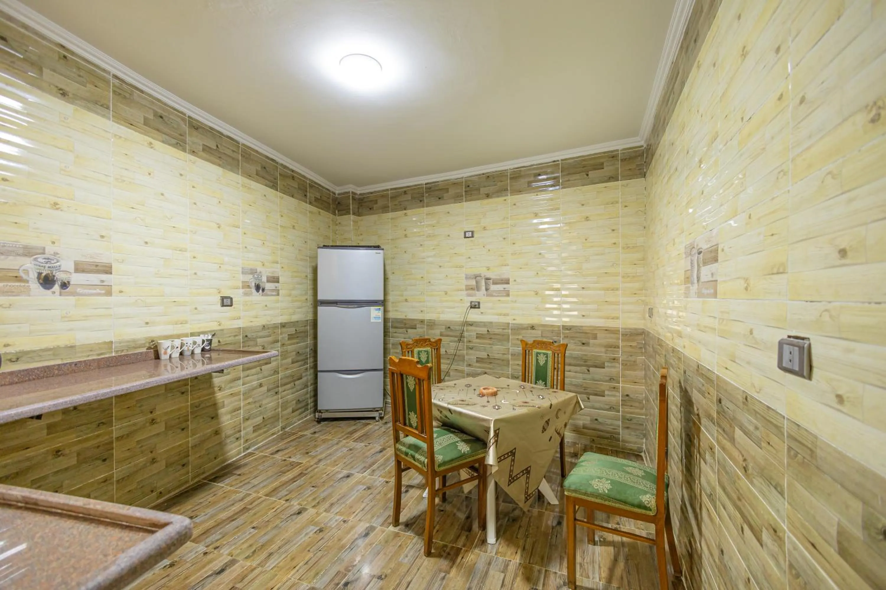 Kitchen or kitchenette in Chez l'ami hotel