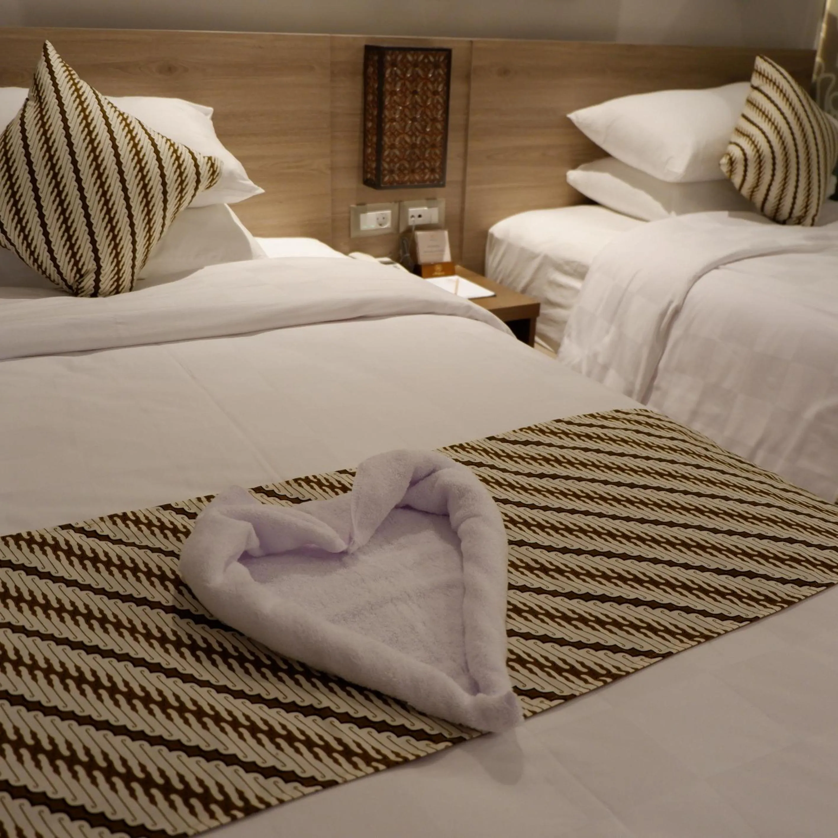 Bed in The Margaux Hotel Yogyakarta