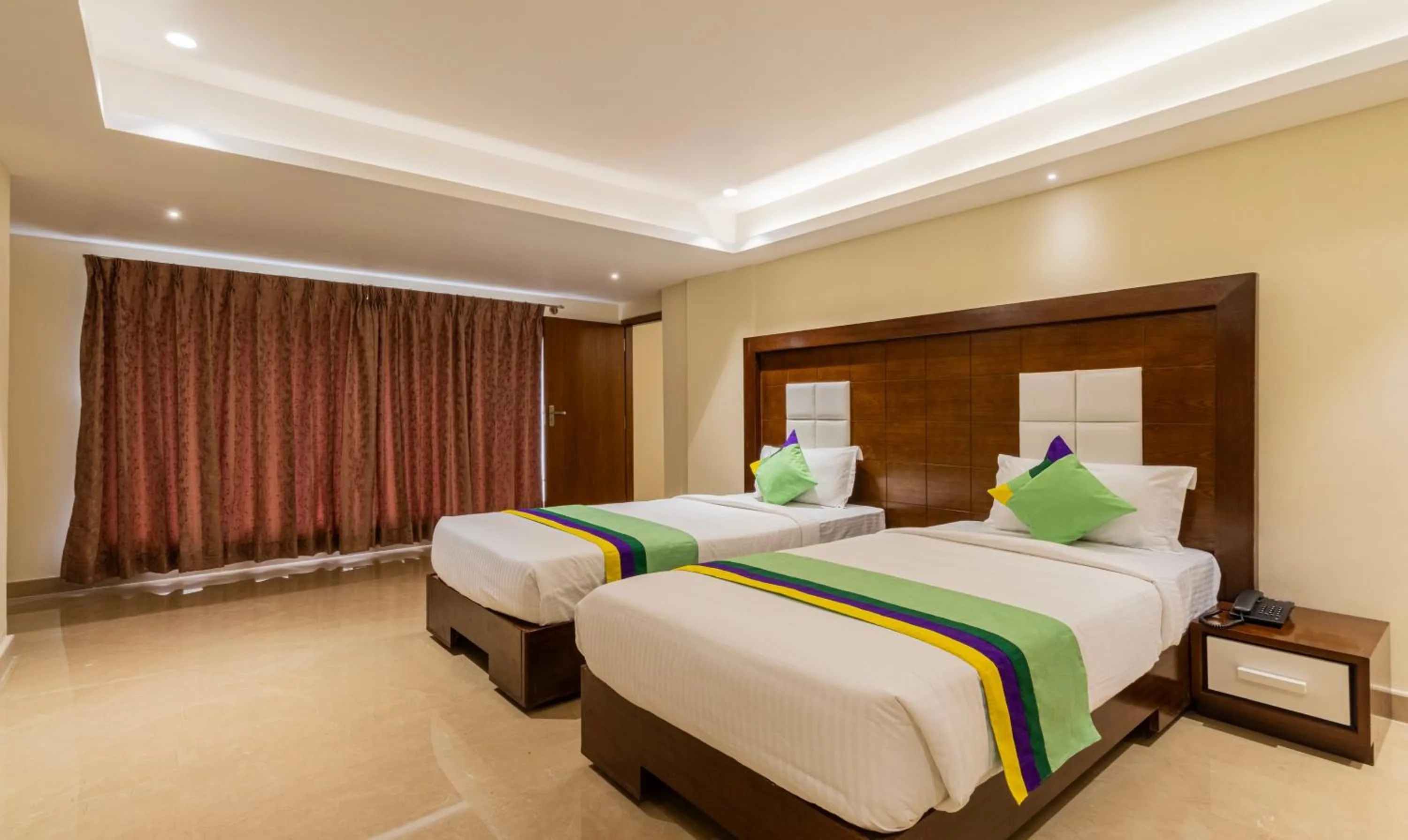 Bedroom, Bed in Treebo Suvarna Comforts