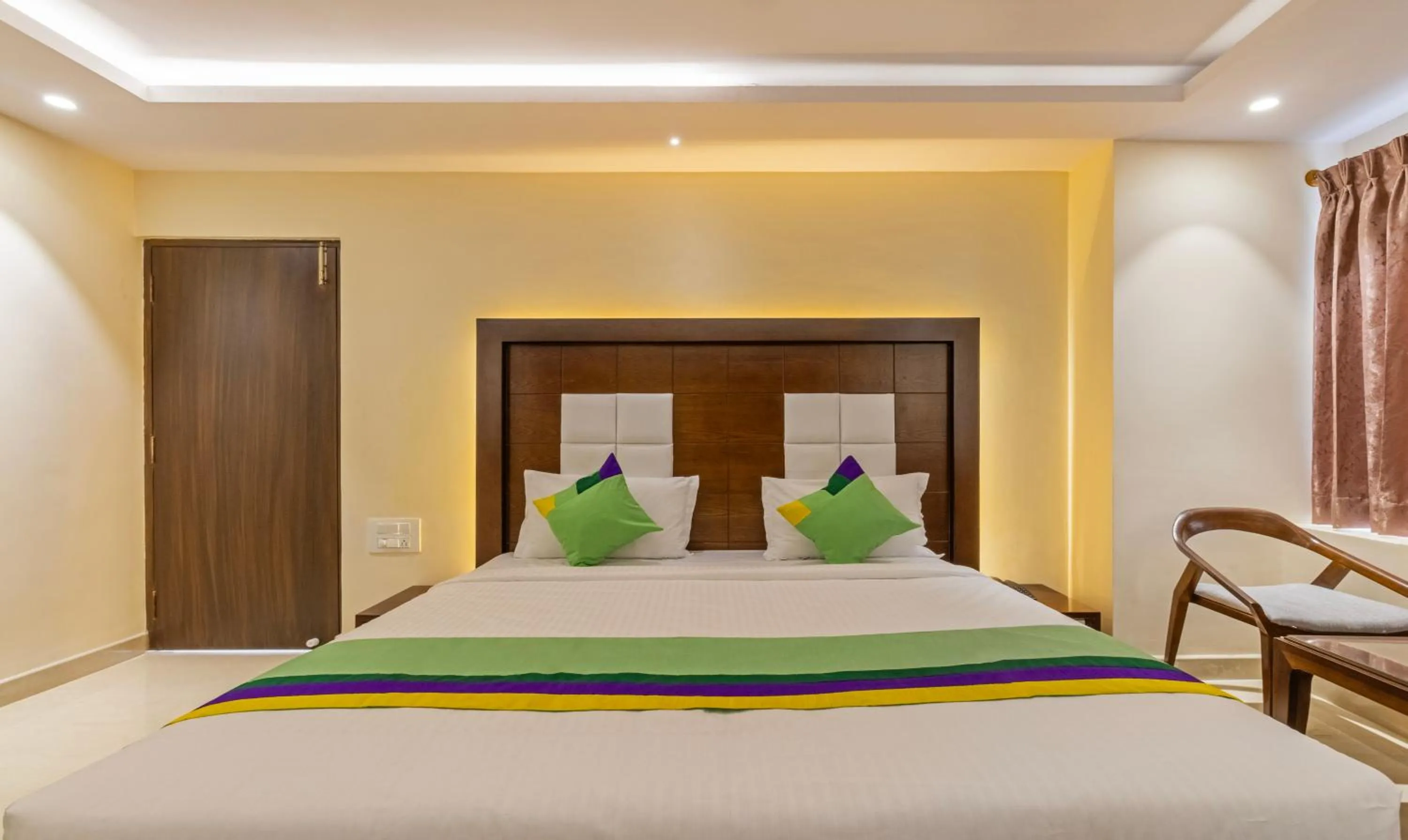 Bedroom, Bed in Treebo Suvarna Comforts