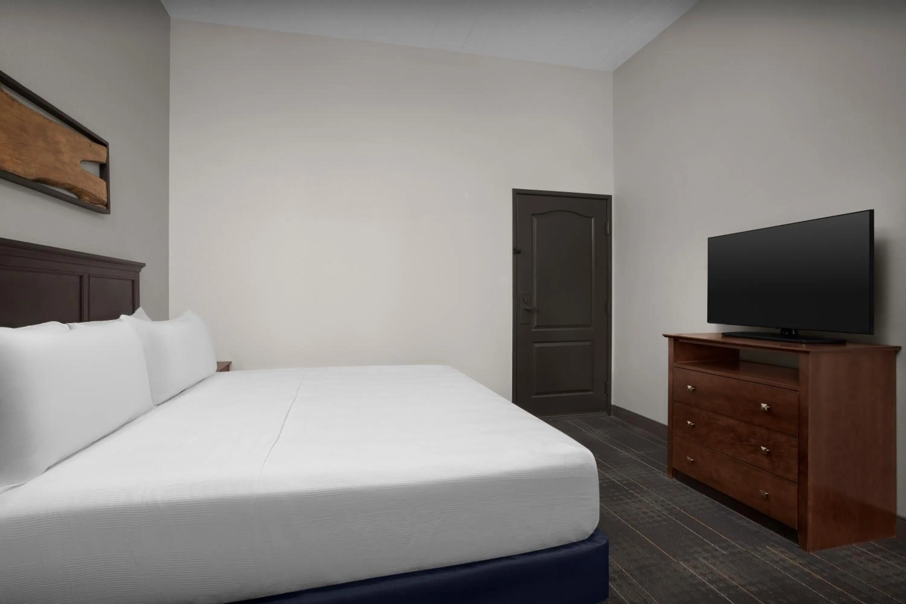 Bed in The Suites Hotel at Waterfront Plaza