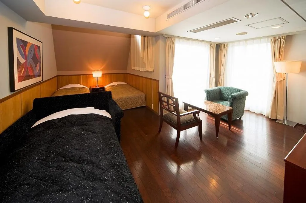Bed in The Residential Suites Fukuoka