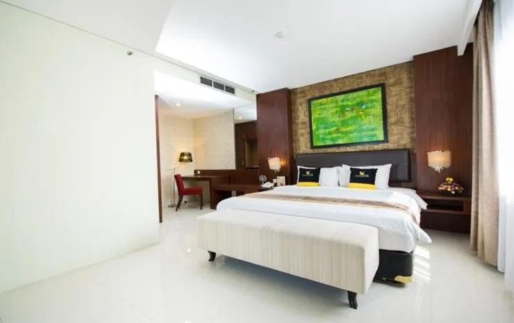 Bed in Noormans Hotel Semarang