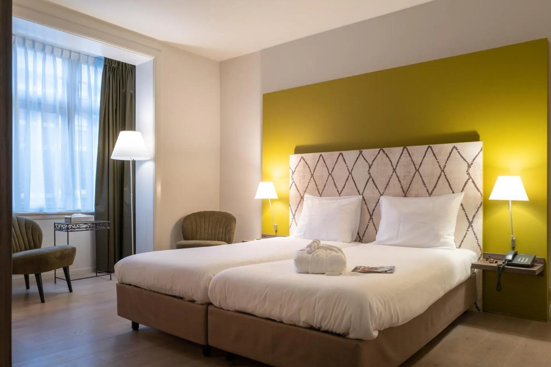 Bed in Hotel Au Quartier