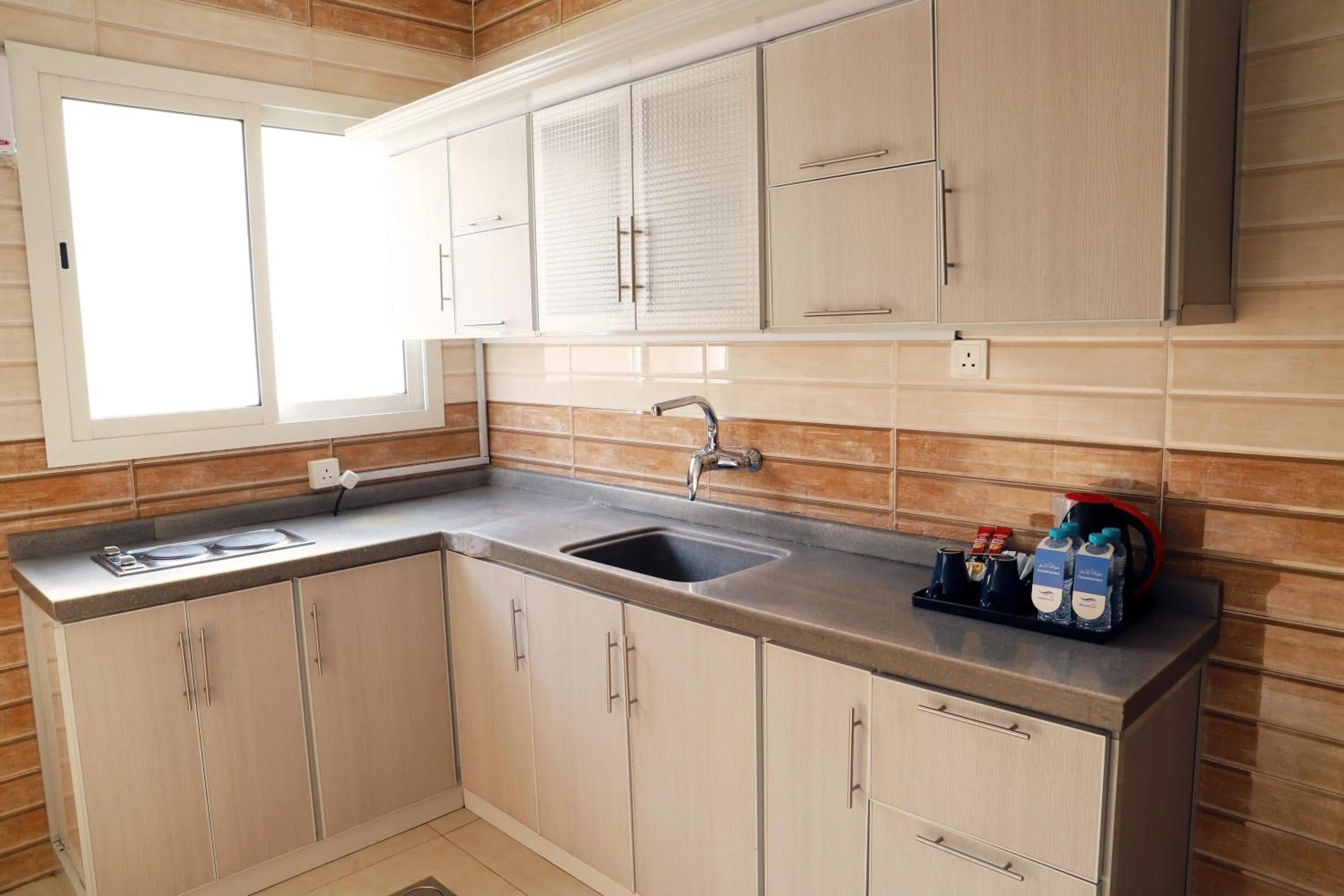 Kitchen or kitchenette in Sunrise Suites