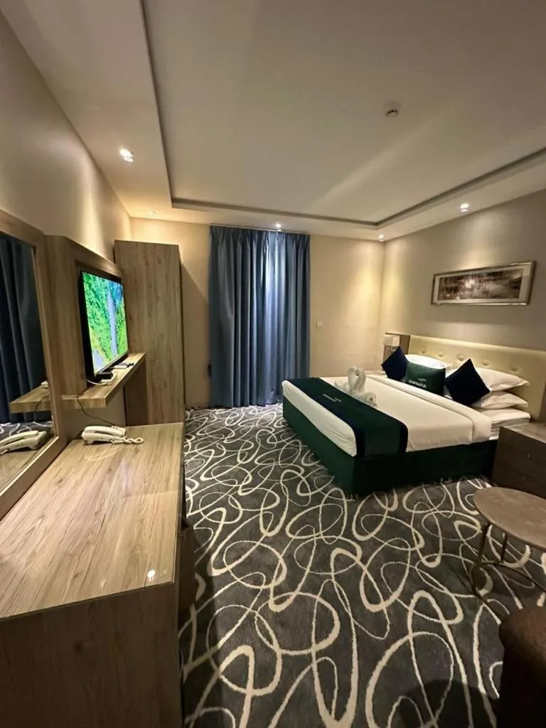 Bed in Sunrise Suites