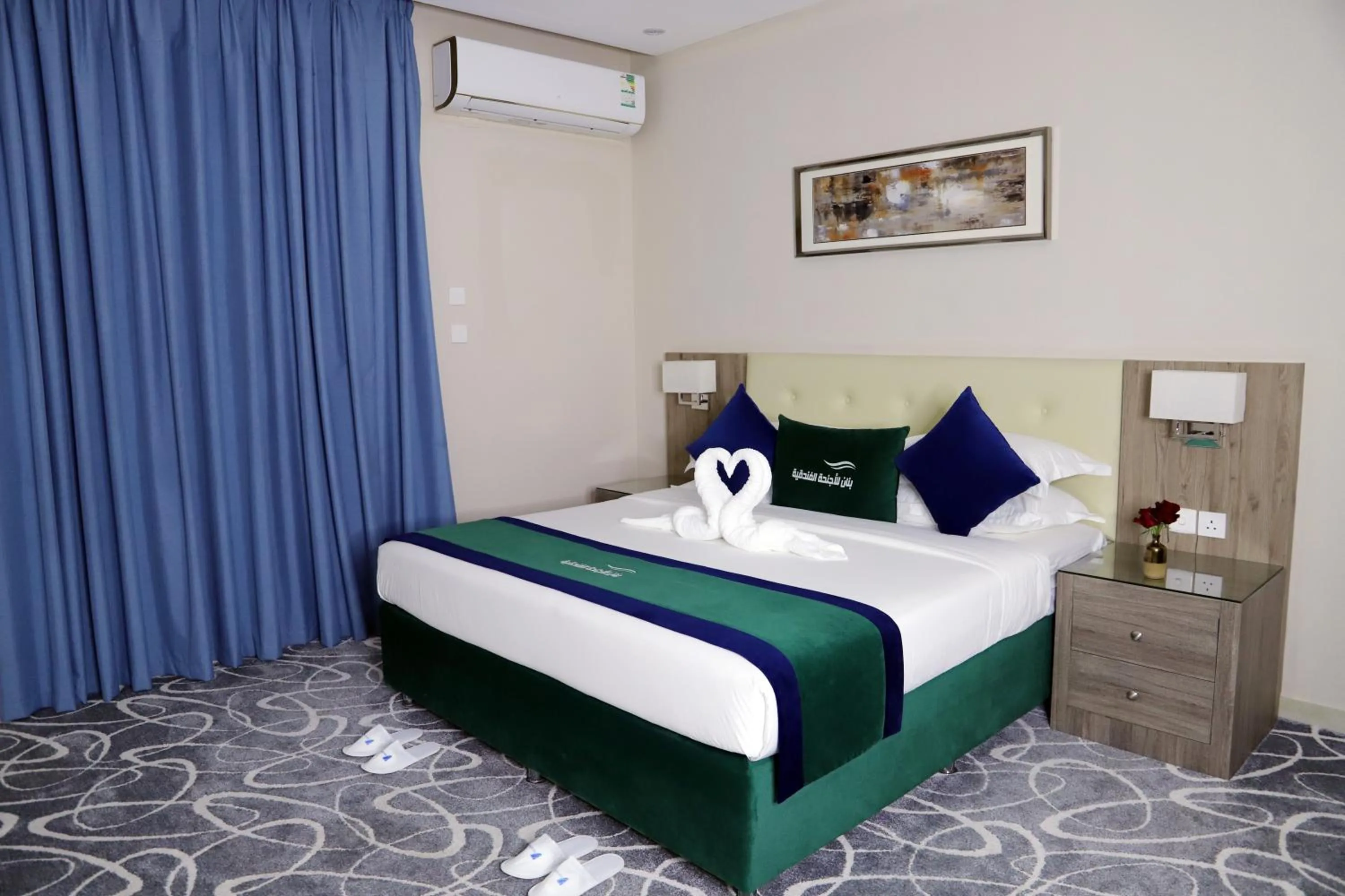 Bed in Sunrise Suites