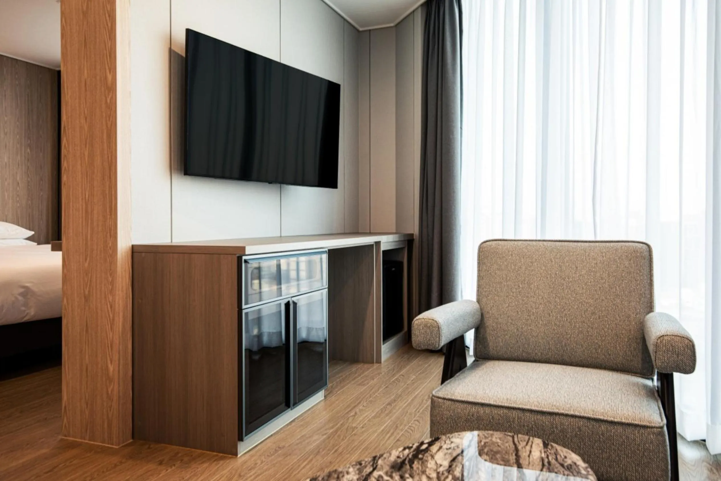 Living room, Bed in Jeju Bolton Hotel