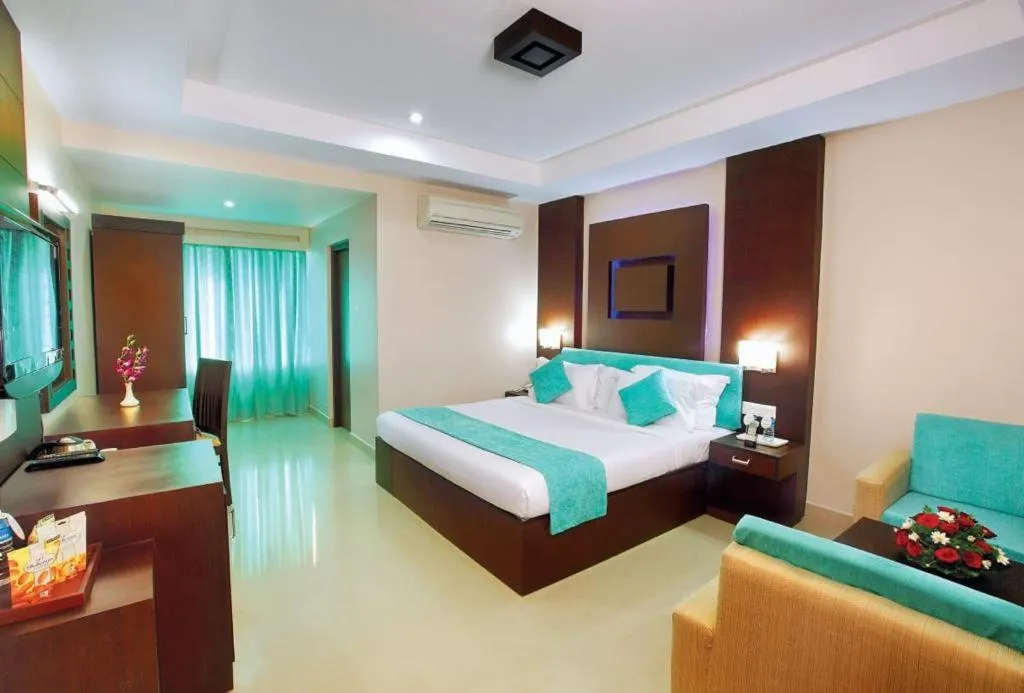 Bed in HOTEL SRIVATSA REGENCY