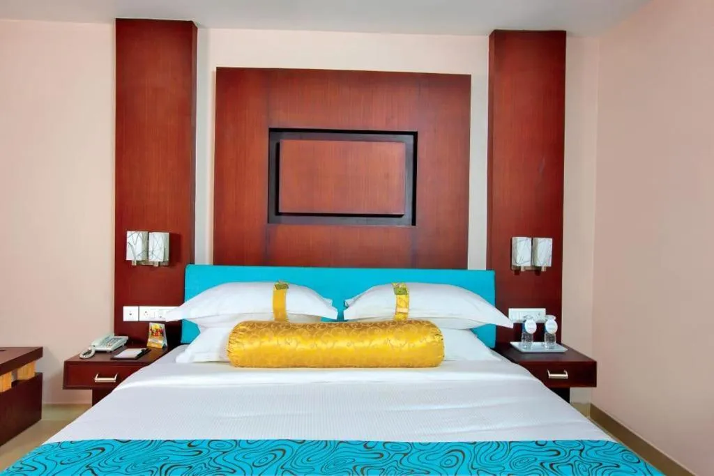 Bed in HOTEL SRIVATSA REGENCY