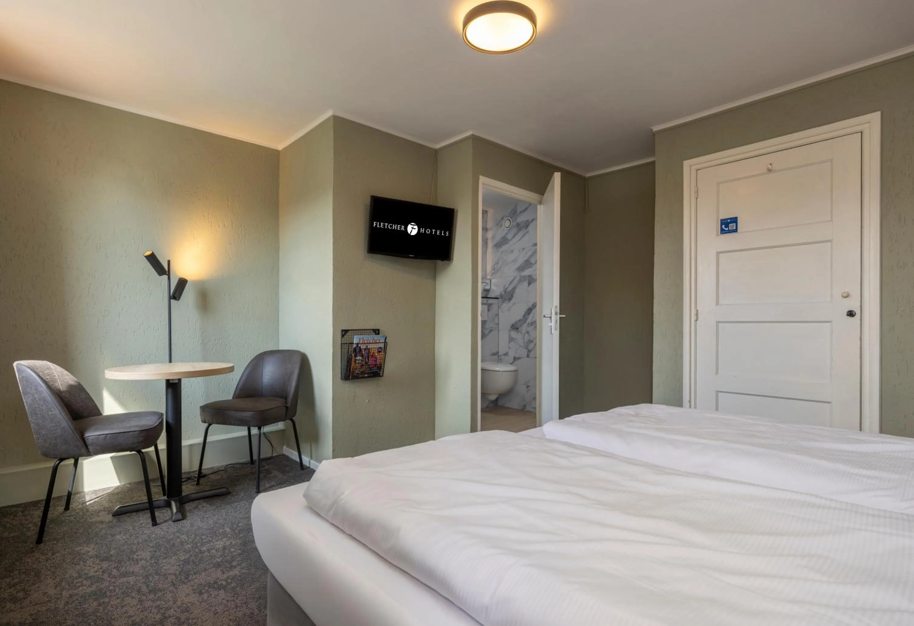 Seating area, Bed in Fletcher Hotel Restaurant Bon Repos