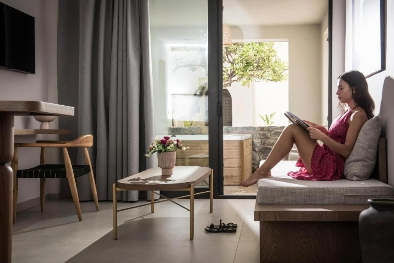 Communal lounge/ TV room in VAYA Suites by Omilos Hotels