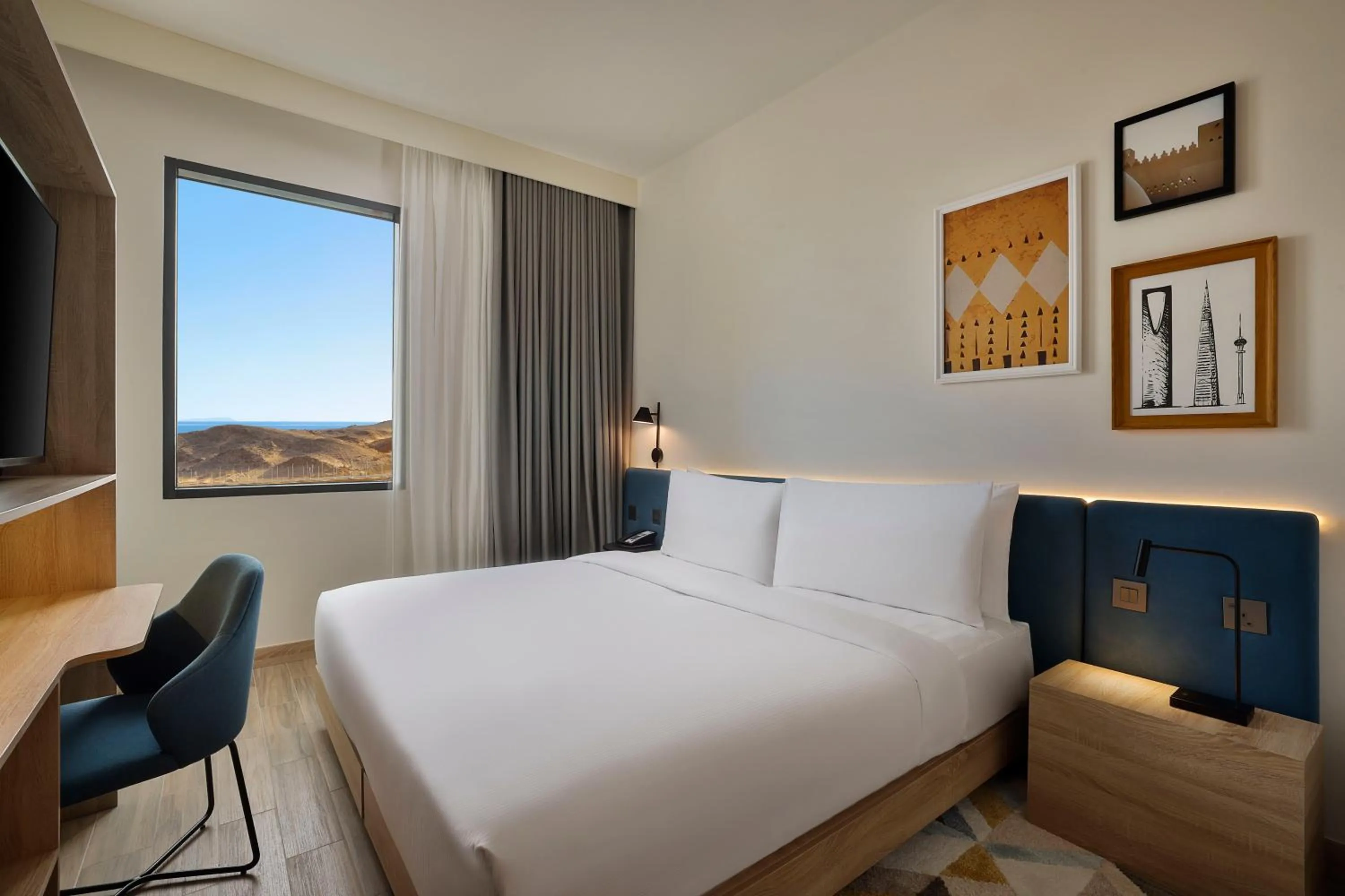 Photo of the whole room, Bed in Hampton by Hilton Sharma NEOM Community 1