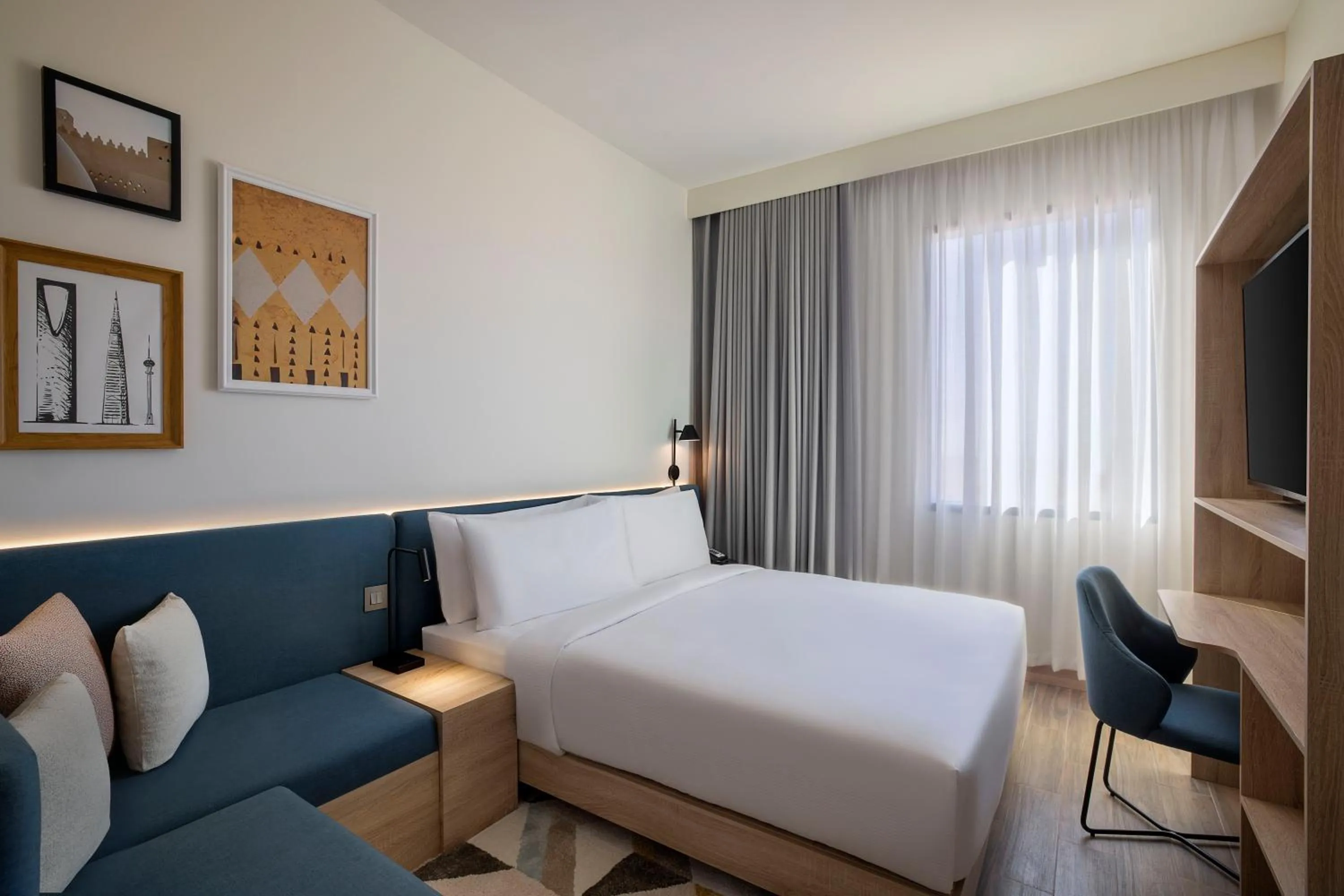 Photo of the whole room, Bed in Hampton by Hilton Sharma NEOM Community 1