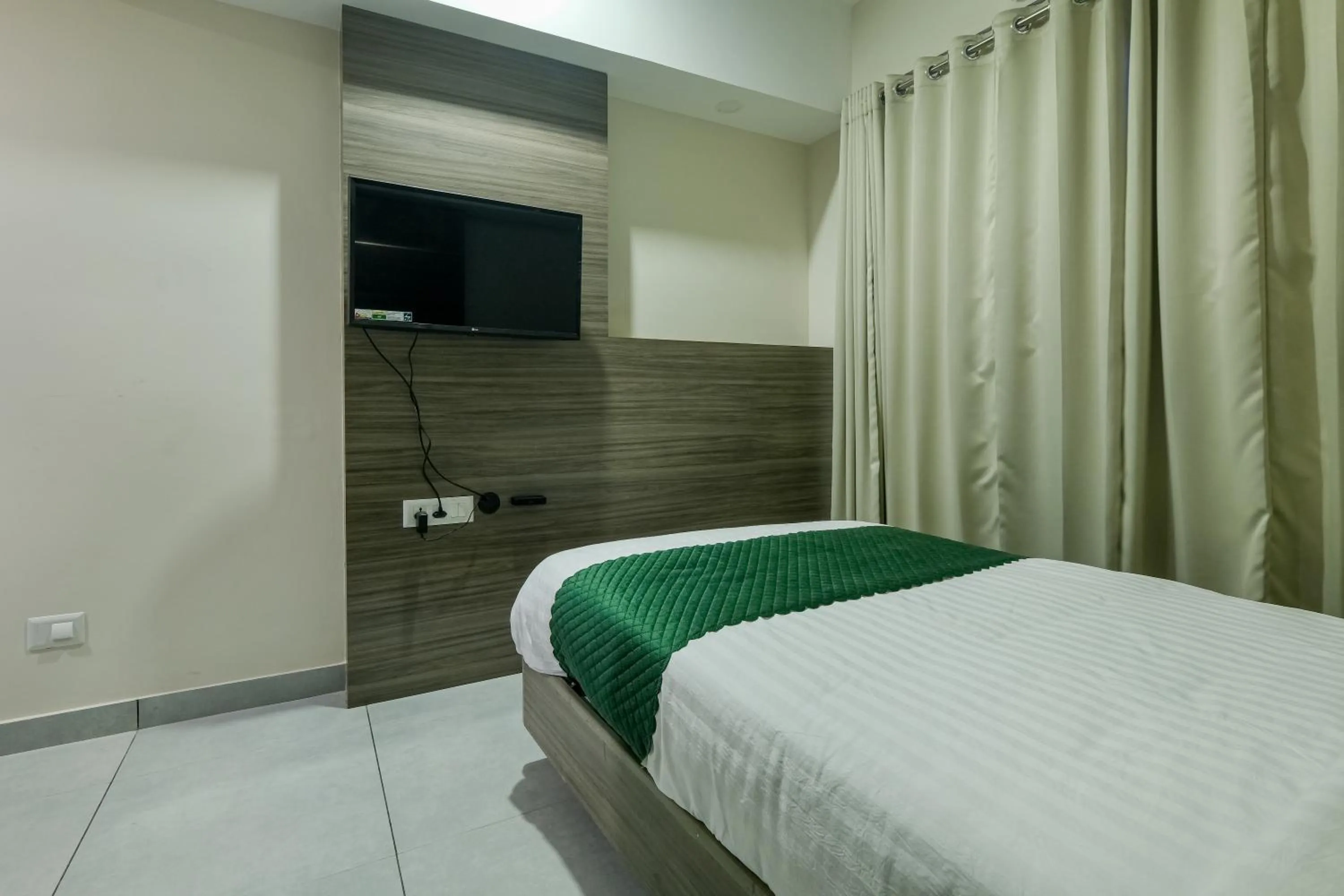 Bed in The Heartland Business Hotel