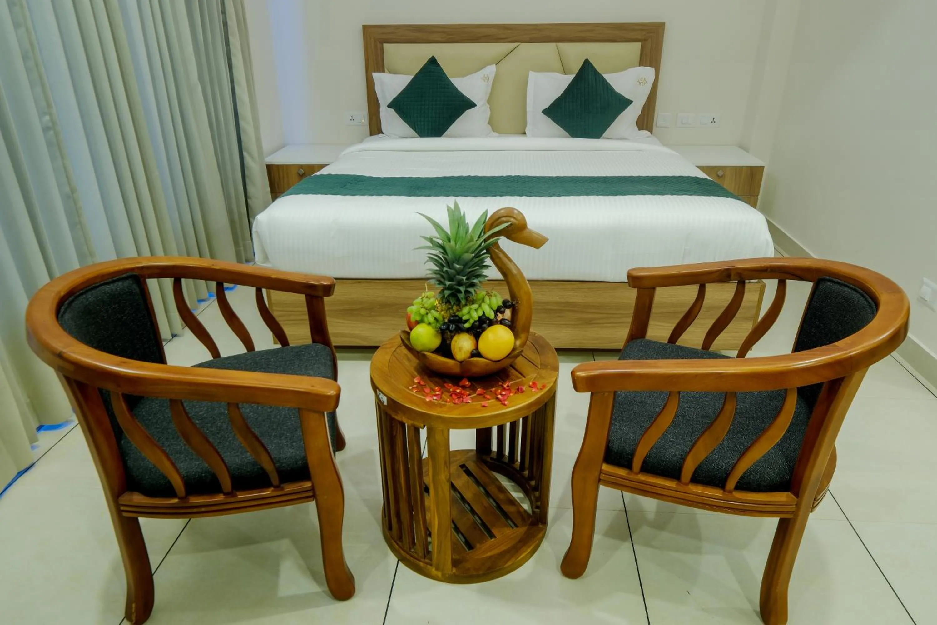 Seating area, Bed in The Heartland Business Hotel
