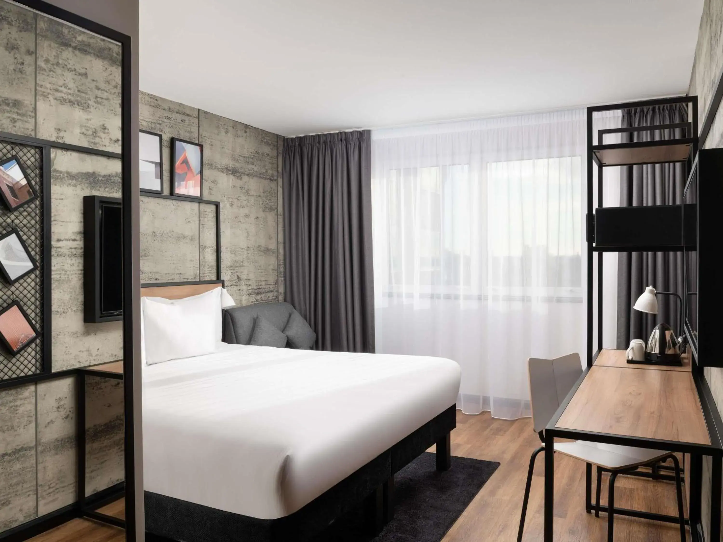 Superior Triple Room with Two Single Beds and One Sofa in ibis London Earls Court Superior Triple Room with Two Single Beds and One Sofa in ibis London Earls Court