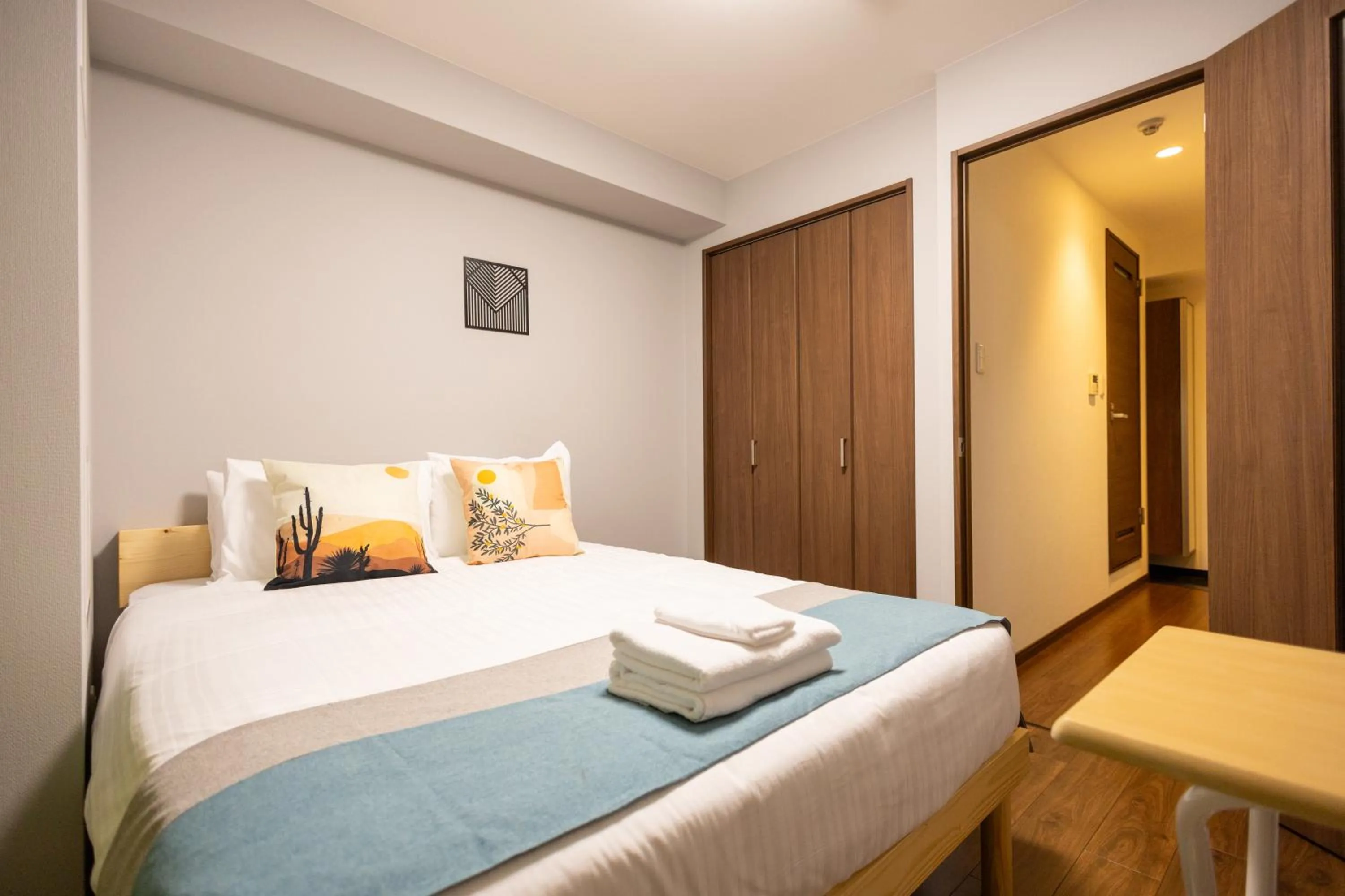 Bed in nestay apartment osaka ebisu