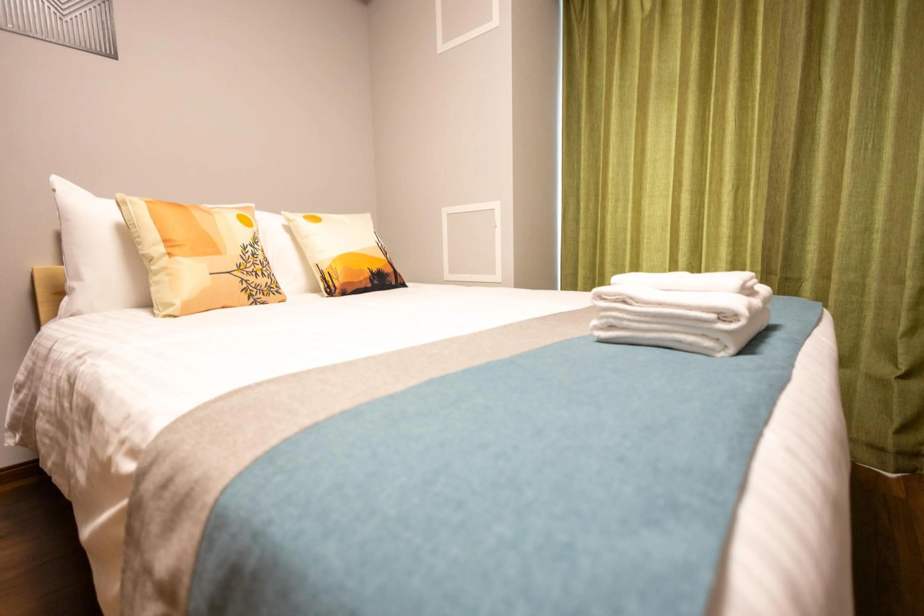 Bed in nestay apartment osaka ebisu