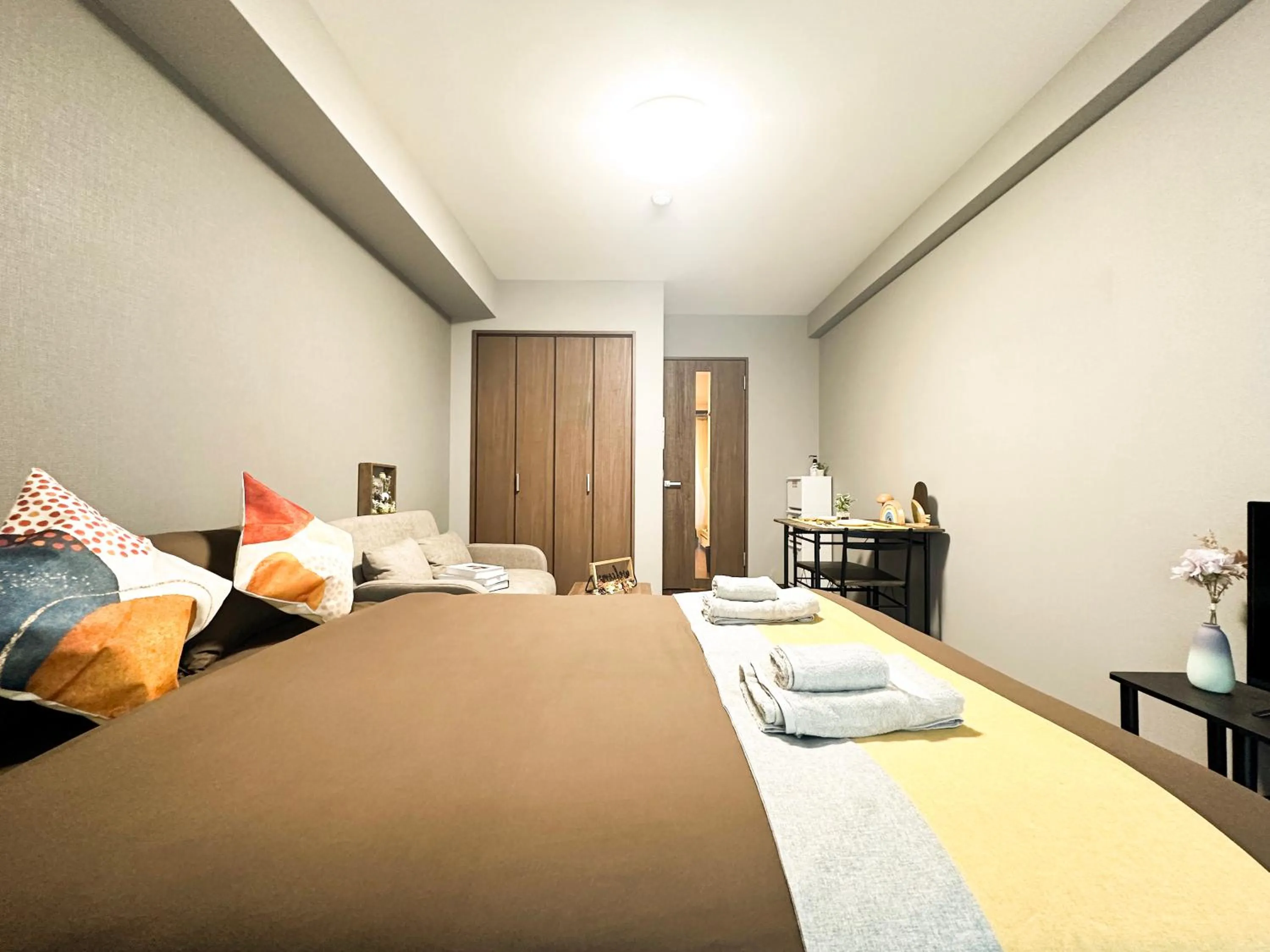 Bed in nestay apartment osaka ebisu