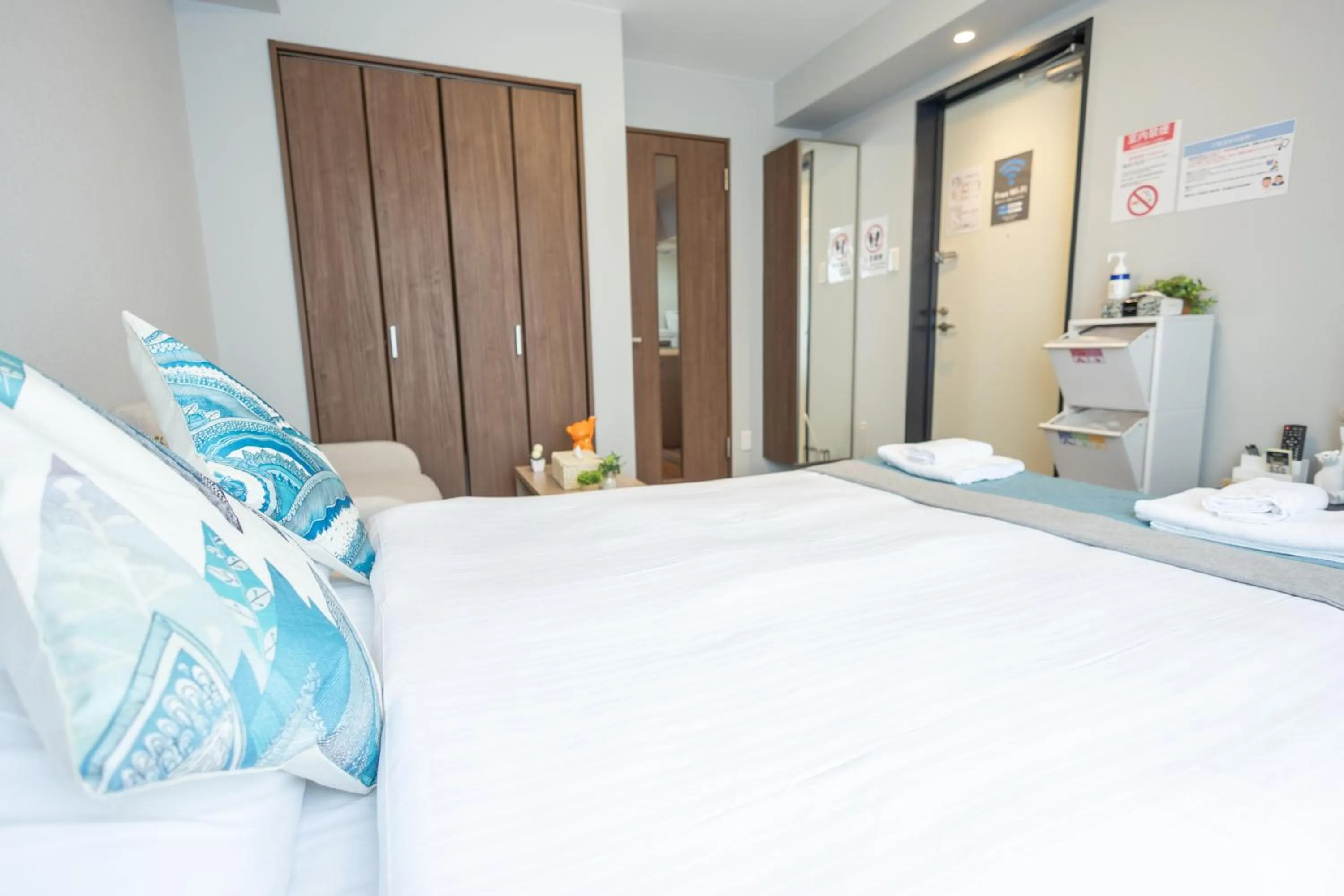 Bed in nestay apartment osaka ebisu